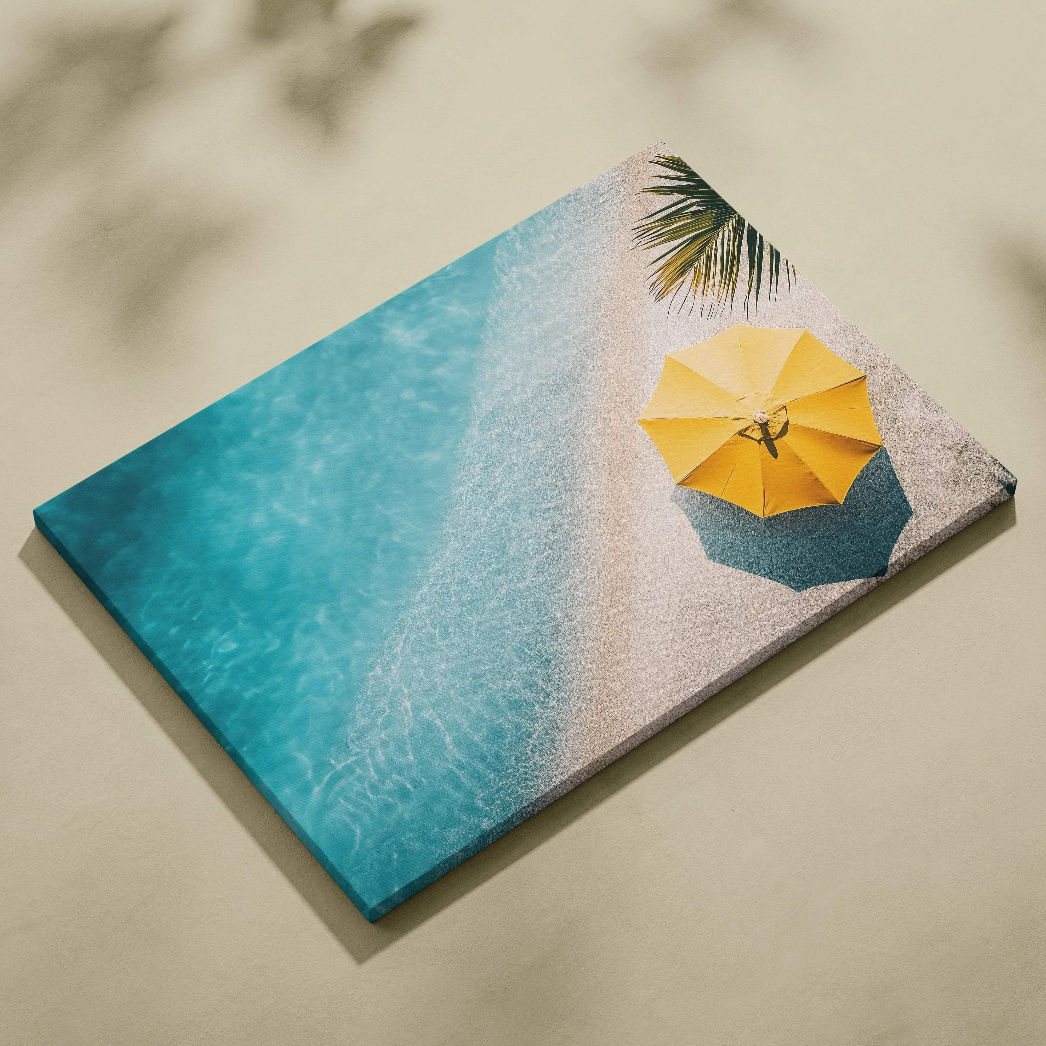 Vibrant yellow beach umbrella over turquoise ocean waves and white sand canvas art