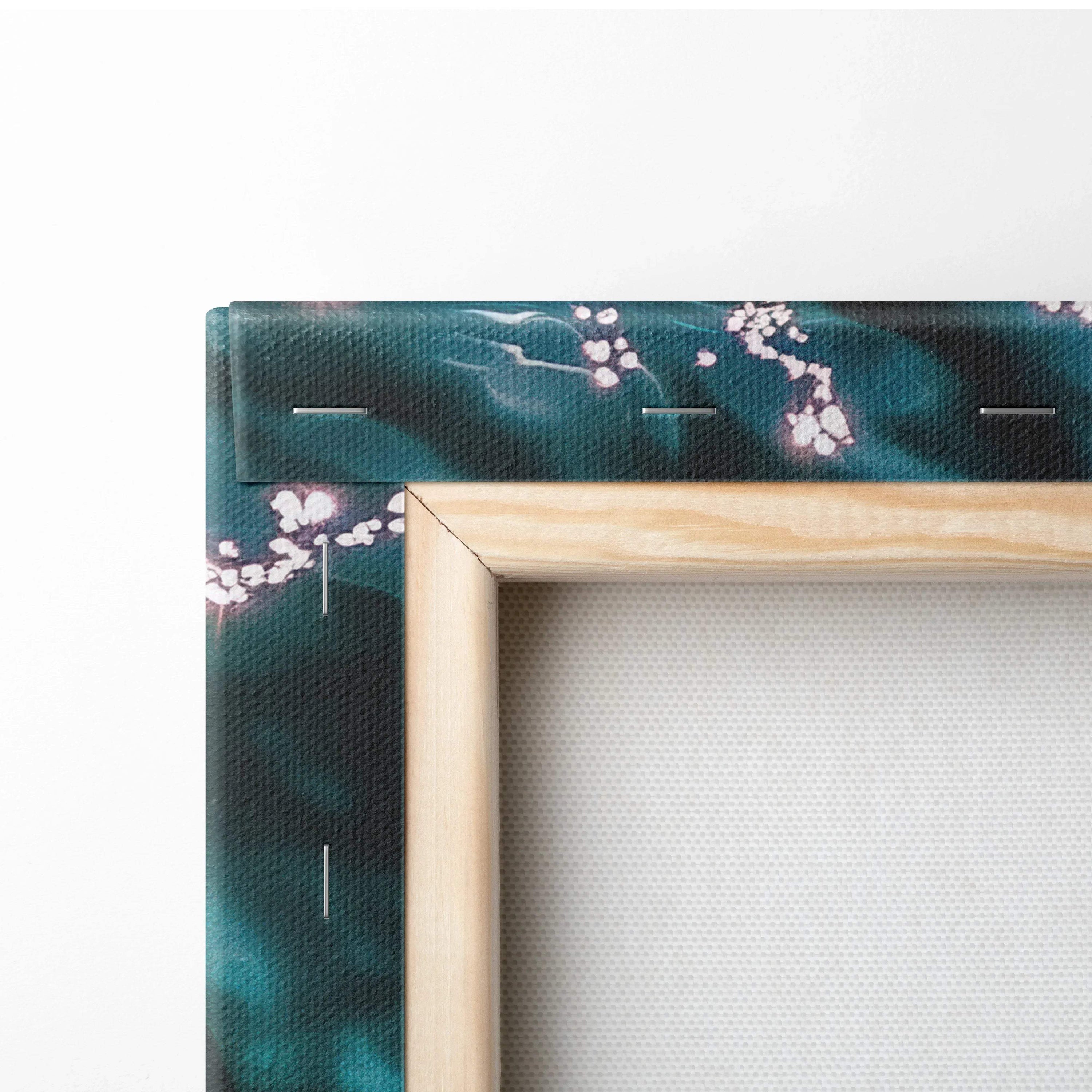Framed teal canvas wall art with white cherry blossoms and light wood frame