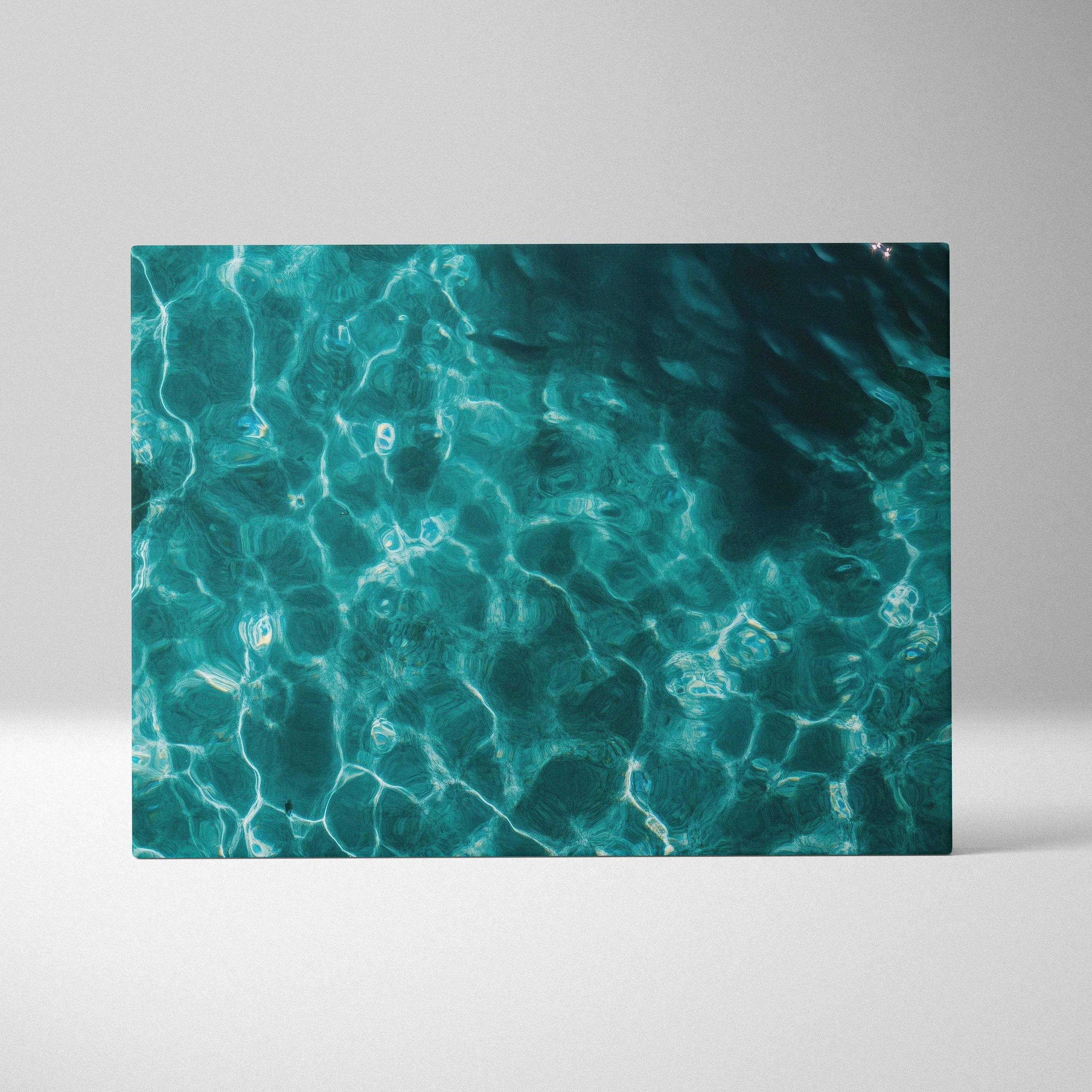 Canvas wall art of sunlit turquoise ocean waters with rippling teal reflections