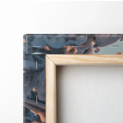 Close-up of wooden frame corner with canvas print showing dark blue and orange mountain and sky details on textured fabric.
