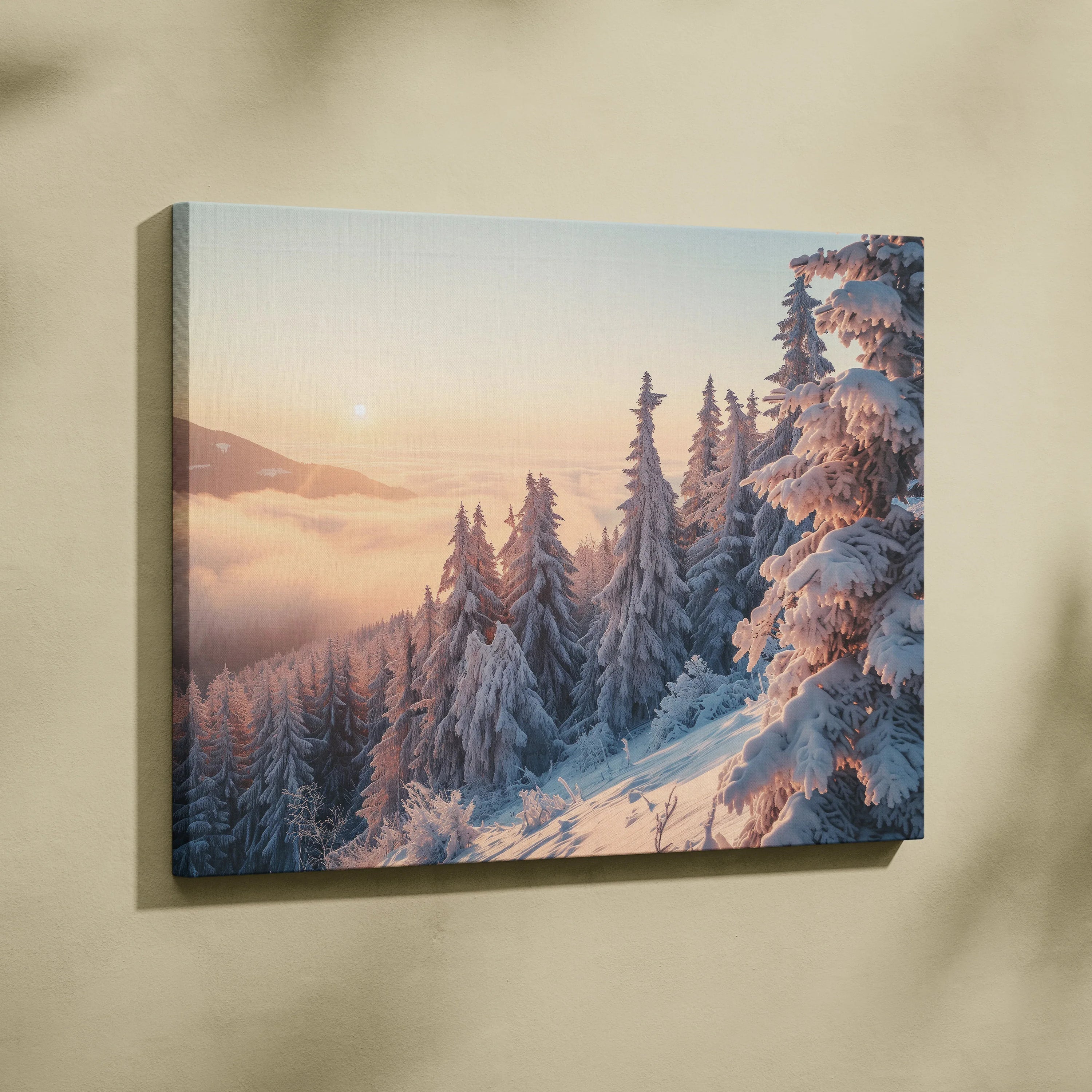 Canvas wall art depicting a snowy mountain landscape with pink and orange sunset sky and frosted evergreen trees.