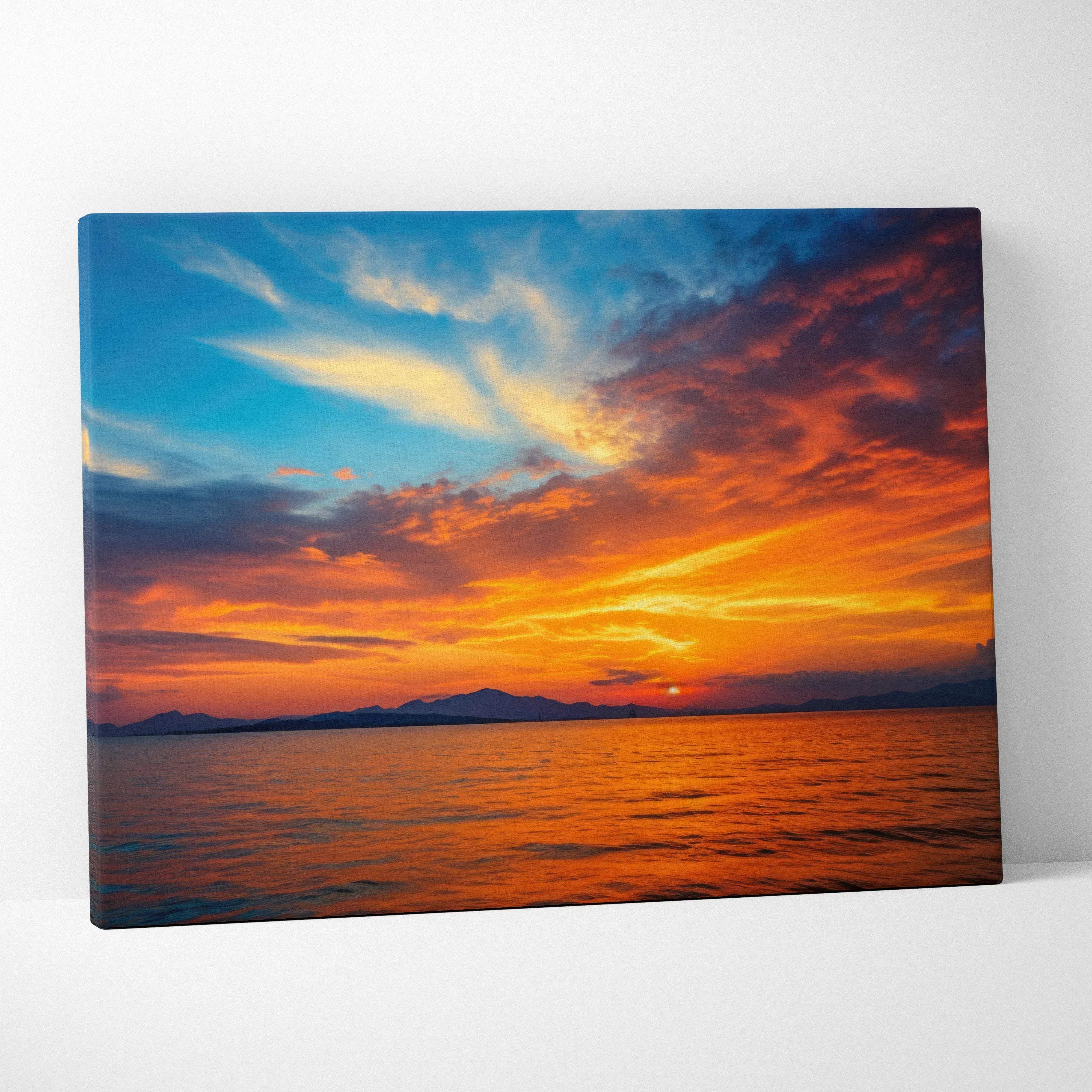 Vibrant canvas wall art of coastal sunset seascape over orange blue ocean sky