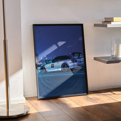 Honda S2000 silver sports car poster in black frame leaning against wall as modern wall art.
