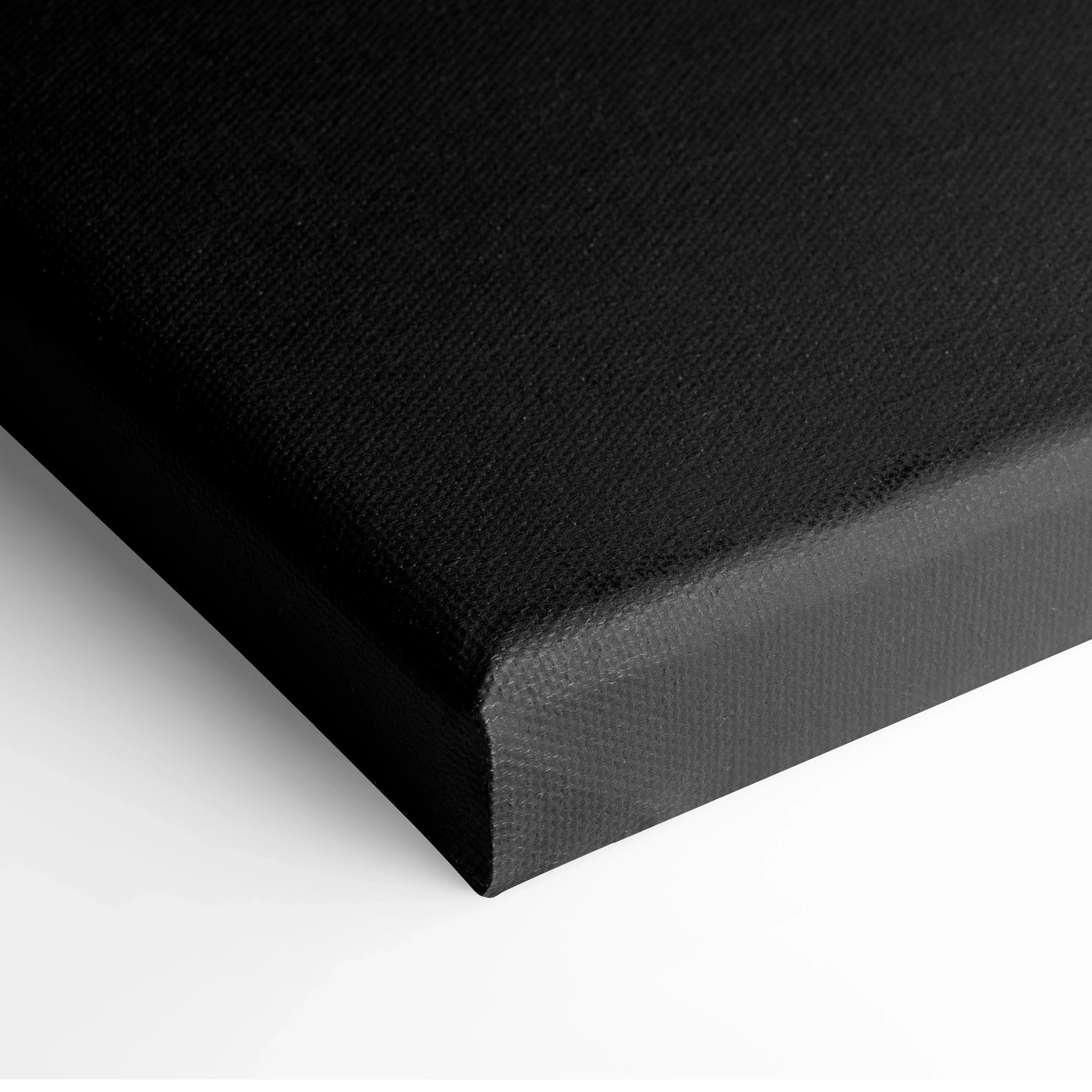 Edge view of black canvas art with textured fabric for minimalist wall decor.