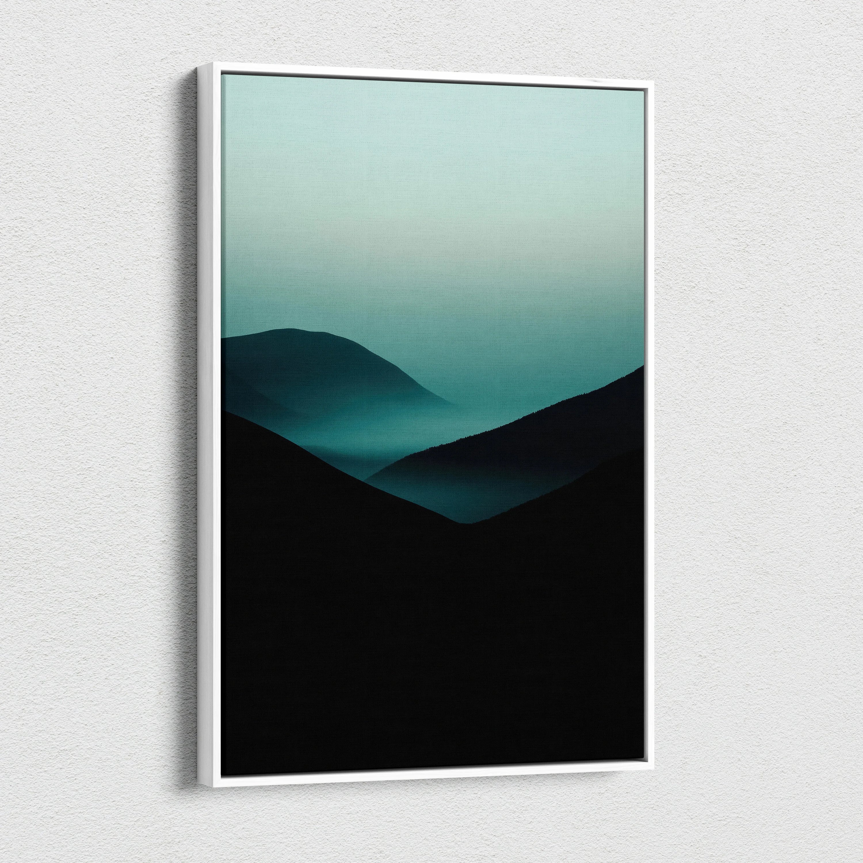 Minimalist canvas wall art featuring dark mountain silhouettes fading into teal fog gradient.