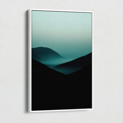 Minimalist canvas wall art featuring dark mountain silhouettes fading into teal fog gradient.