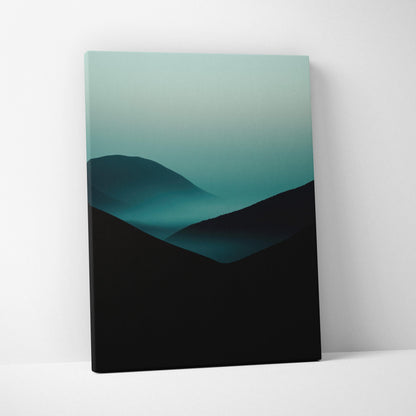 Minimalist canvas art featuring dark mountain silhouettes with soft blue-green fog and gradient sky background.