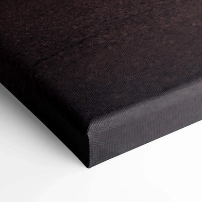 Black wrapped edge vertical canvas wall art with fine textured surface.