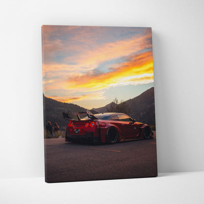 Nissan R35 GTR sports car at sunset on vertical canvas wall art with mountain background.
