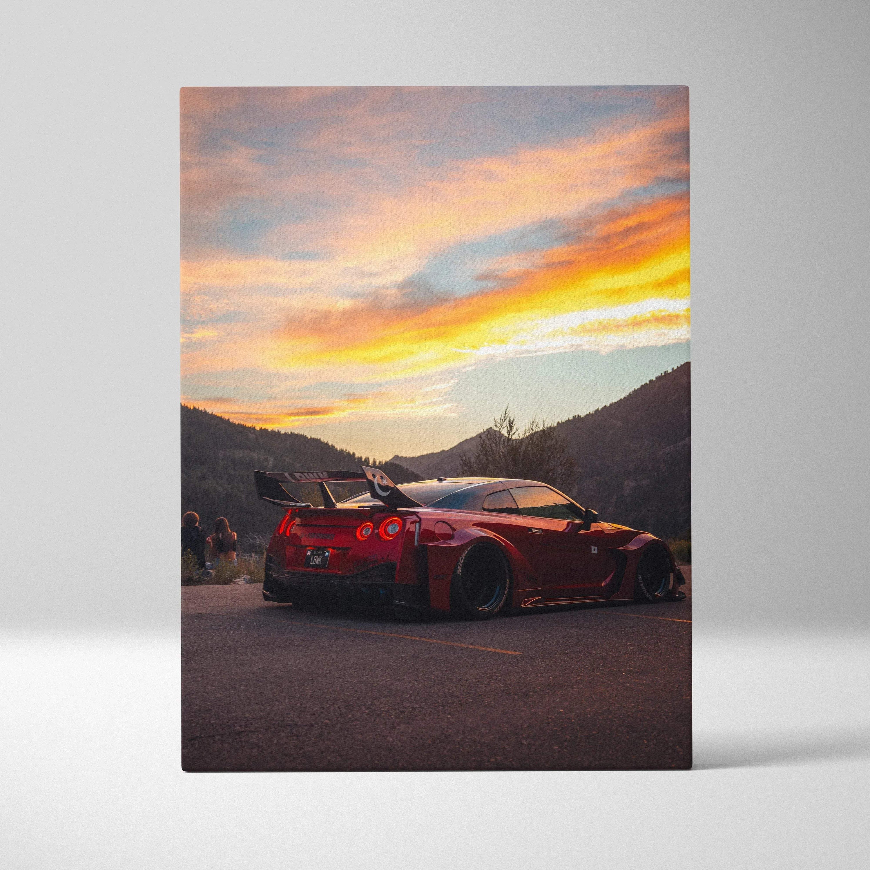 Red Nissan R35 GTR parked on road at sunset mountain landscape vertical canvas wall art.