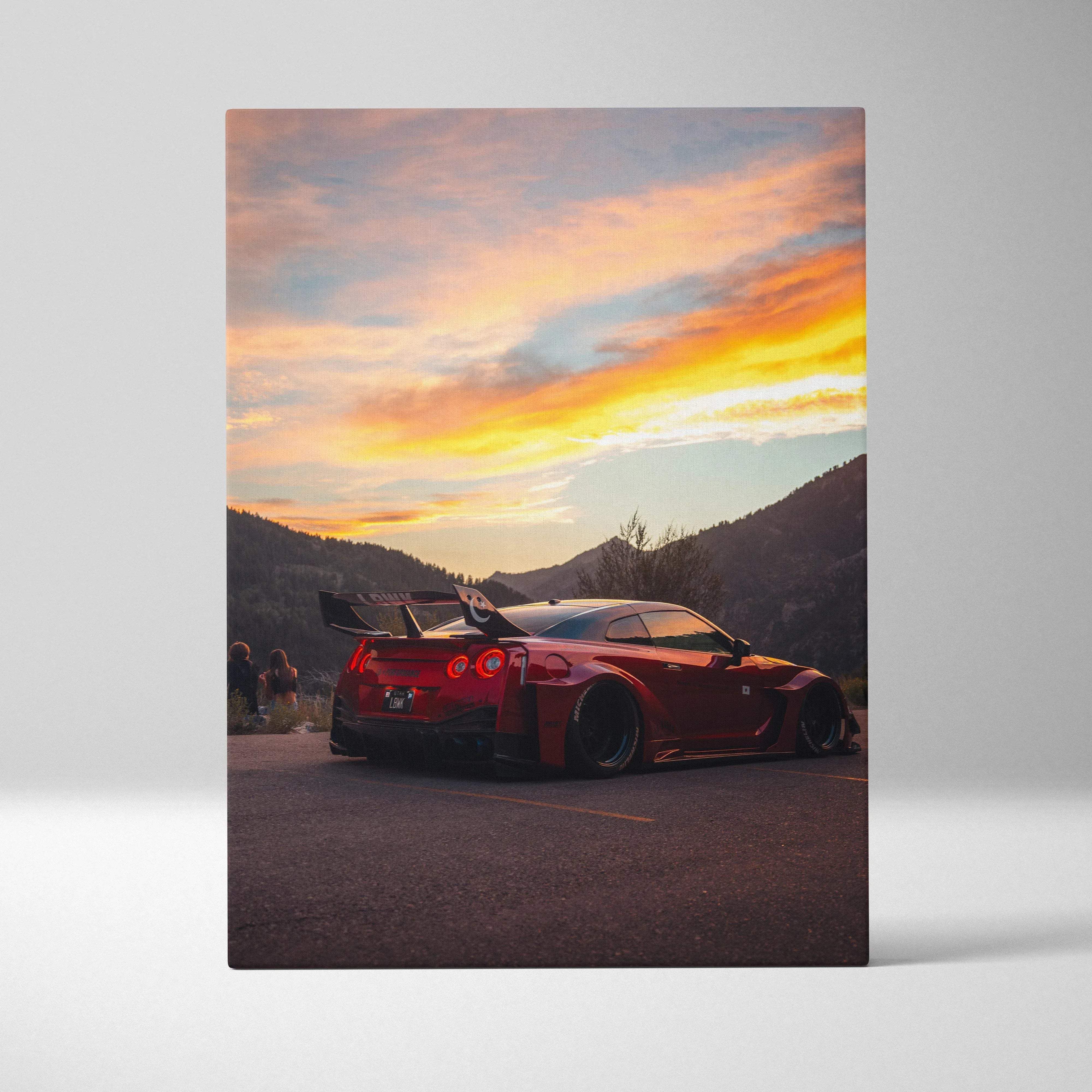 Canvas wall art featuring a red nissan gt-r with rear spoiler and wide-body kit at sunset with mountain backdrop