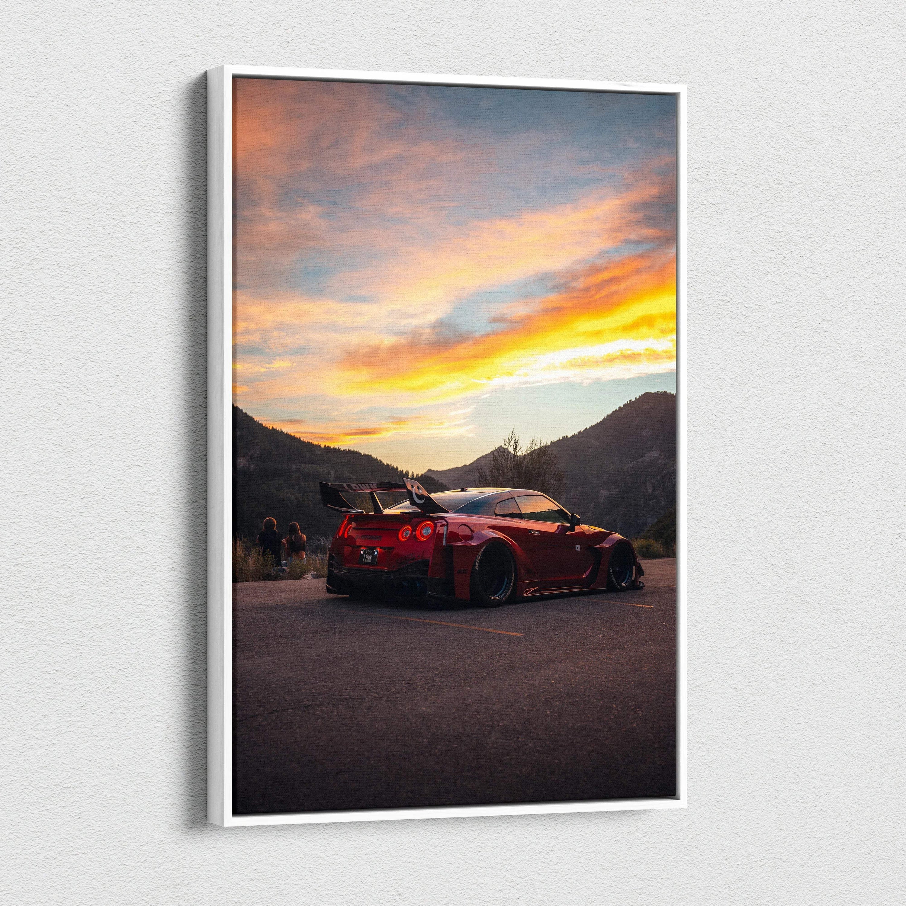 Vertical canvas art wall print featuring a red Nissan R35 GTR against a colorful sunset sky and mountainous backdrop.