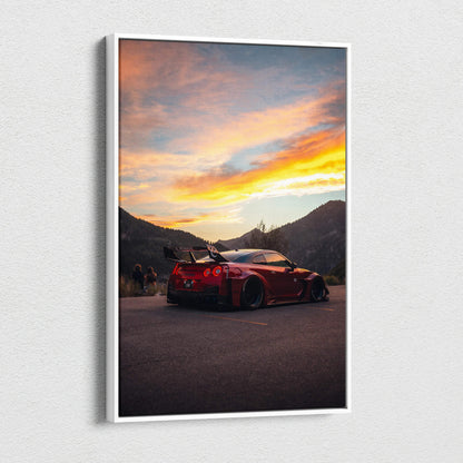 Vertical canvas art wall print featuring a red Nissan R35 GTR against a colorful sunset sky and mountainous backdrop.