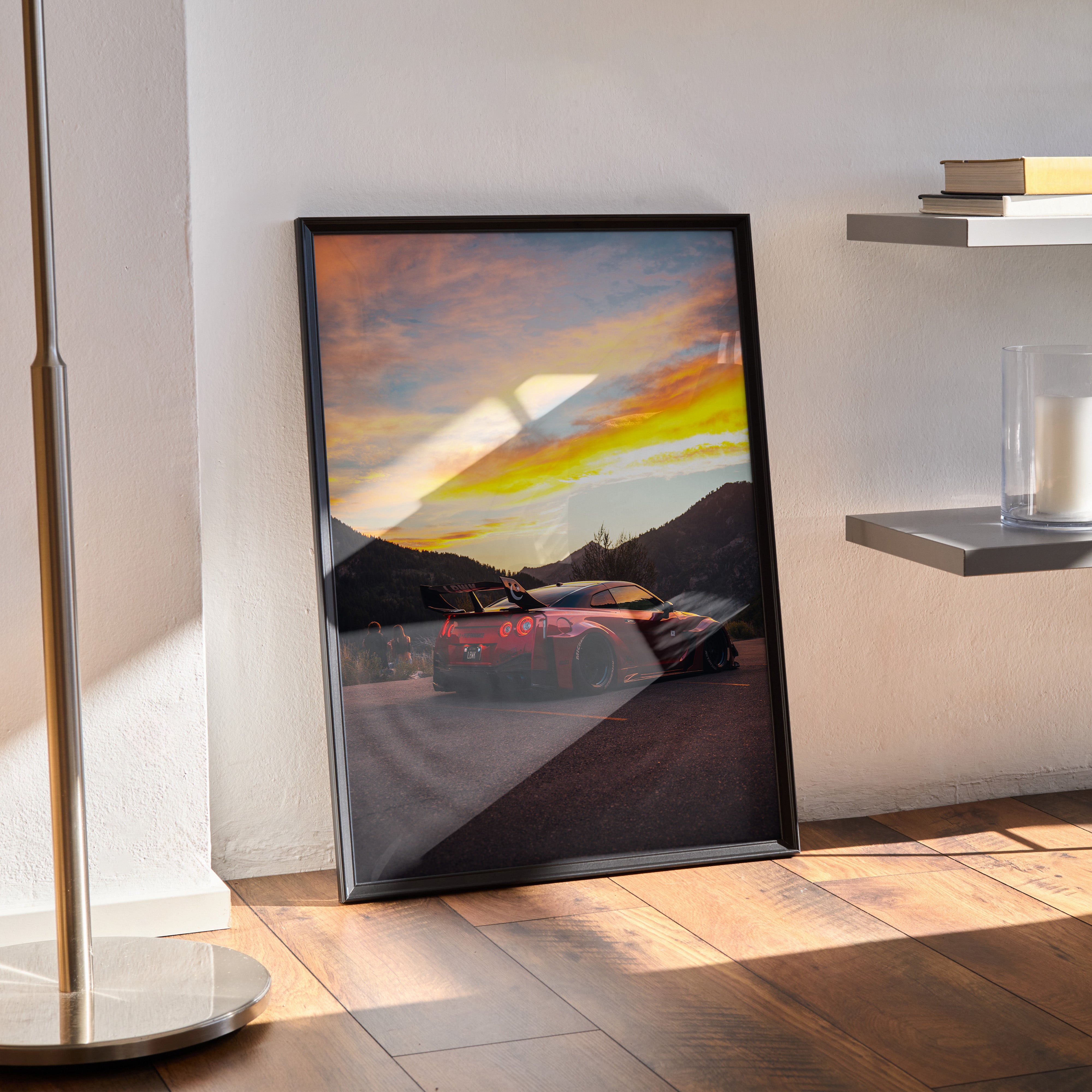 Nissan GTR R35 widebody poster wall art with sunset over mountains in black frame.
