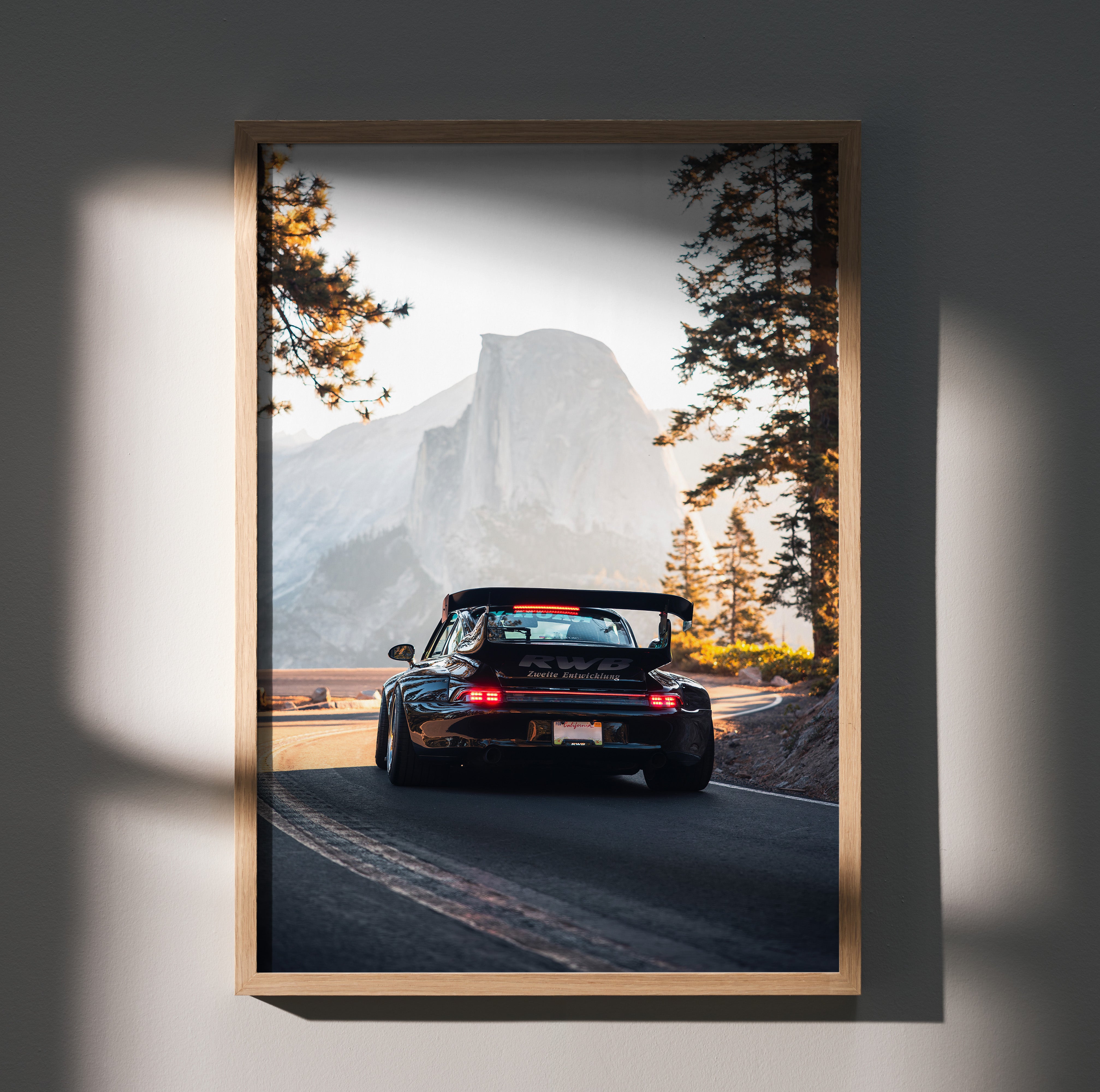 RWB Porsche 911 driving on mountain road automotive poster wall art in wooden frame.