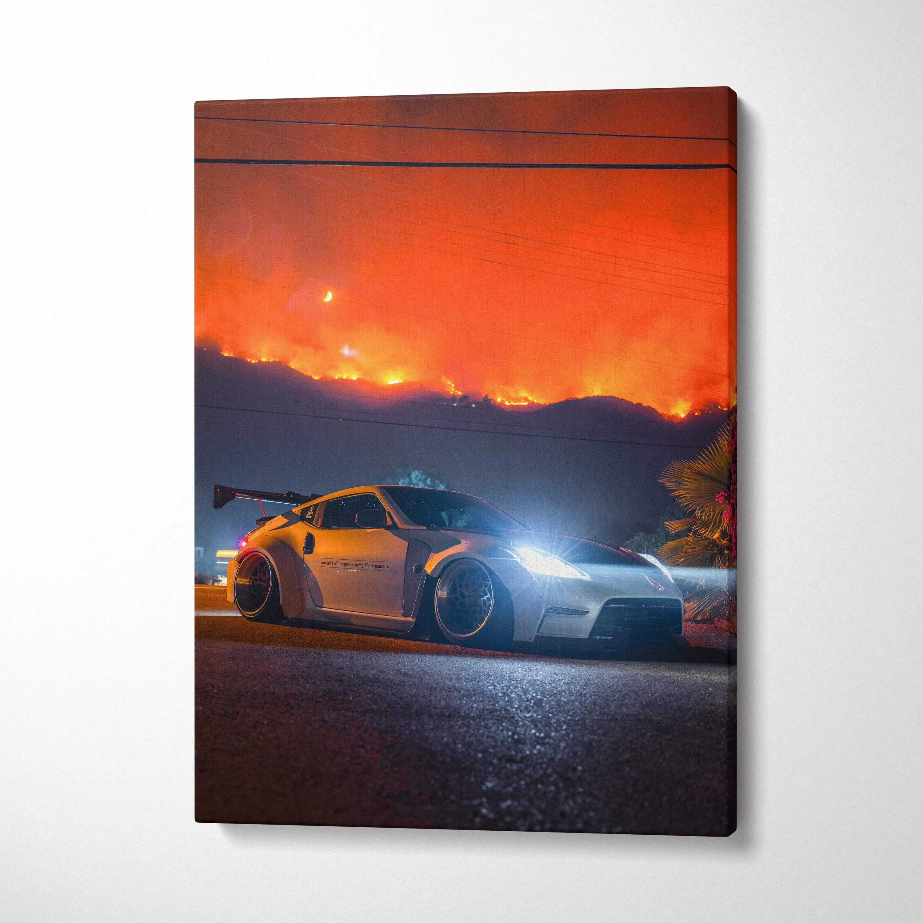 Nissan 370z canvas art with vivid red-orange sky backdrop, vertical wall art print.