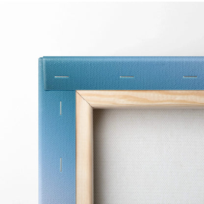 Close-up of blue canvas stretched on wooden frame with visible staples, canvas art wall art detail.