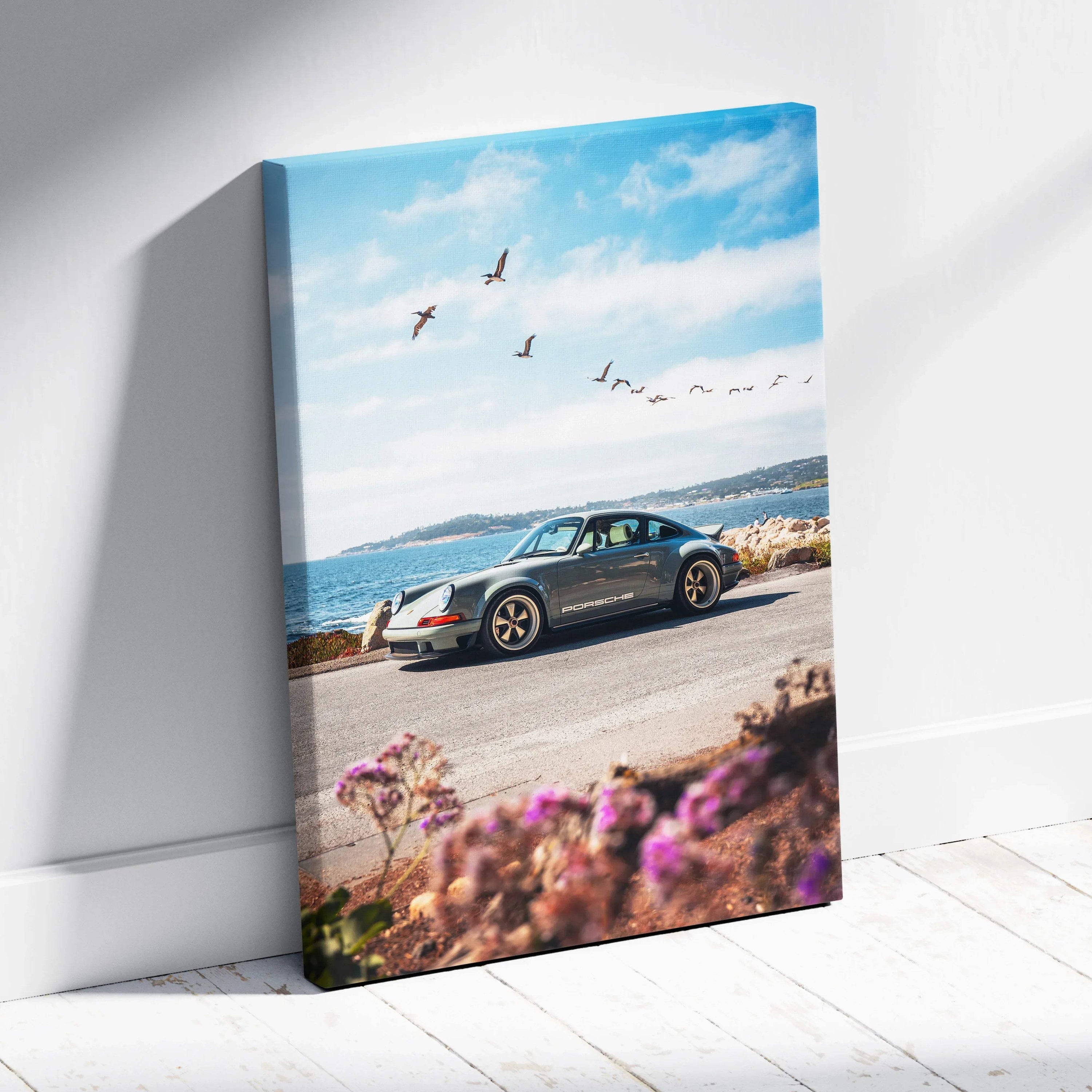 Porsche 911 parked by the sea with blue sky and birds, vertical canvas wall art.