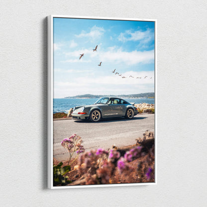 Porsche 911 classic car on coastal road with blue sky canvas wall art vertical print.