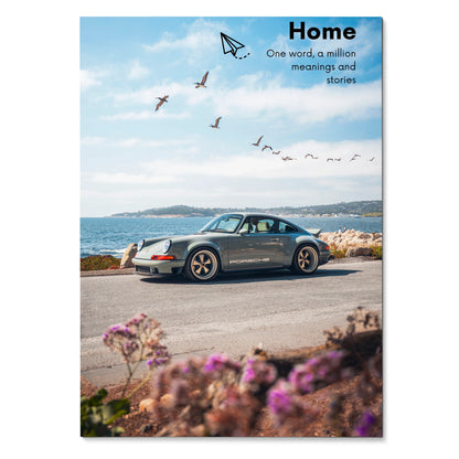 Motivational poster wall art featuring a classic Porsche 911 by the coastline under a blue sky with birds and inspiring text.