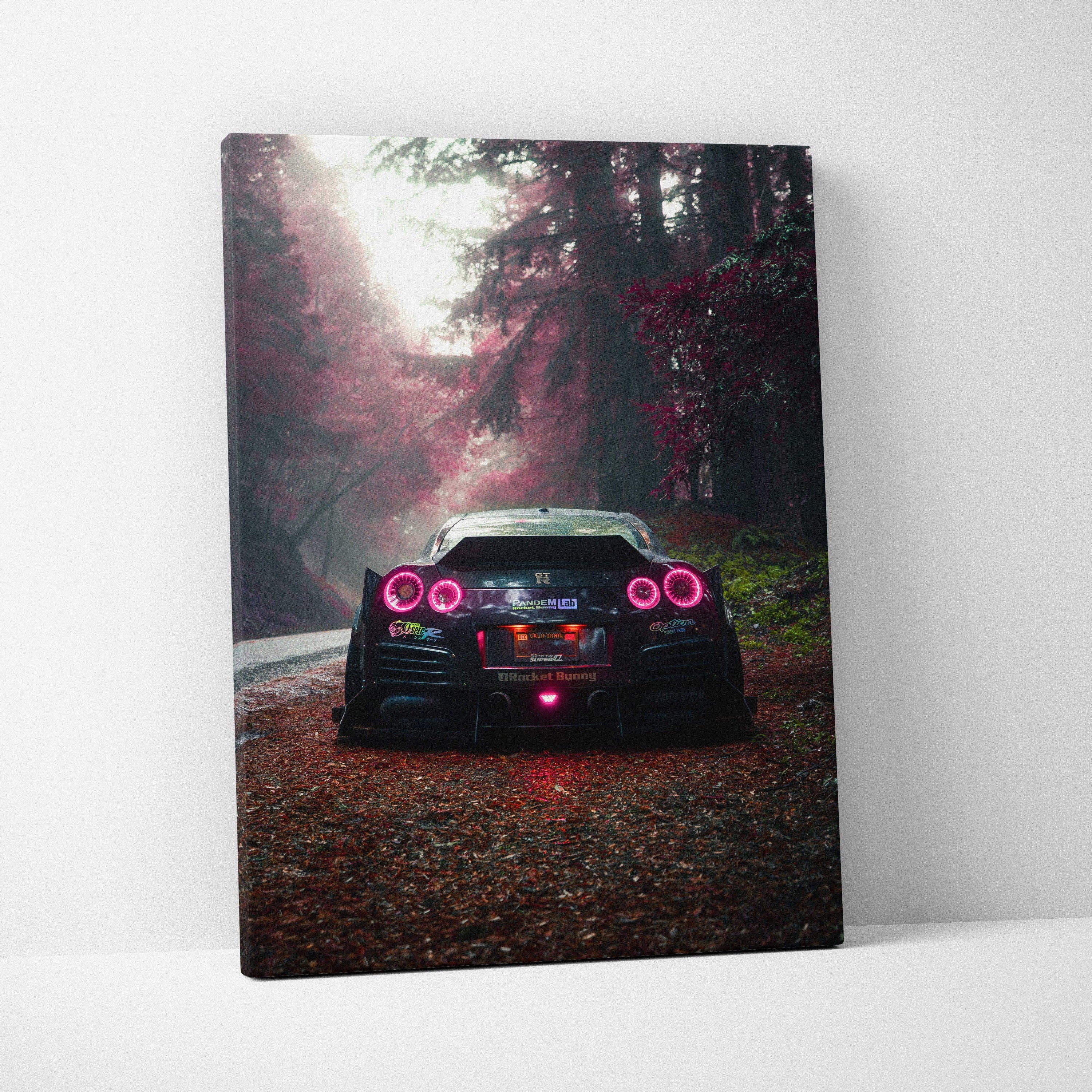 Nissan R35 GTR rear view on forest road canvas wall art with moody lighting and vibrant red taillights.