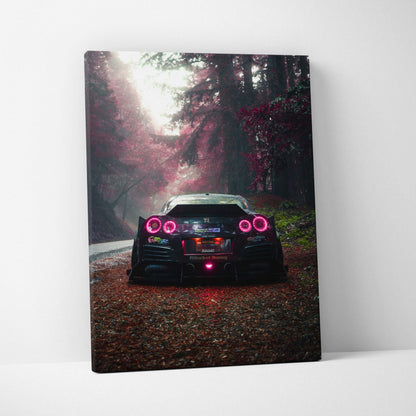 Nissan R35 GTR rear view on forest road canvas wall art with moody lighting and vibrant red taillights.