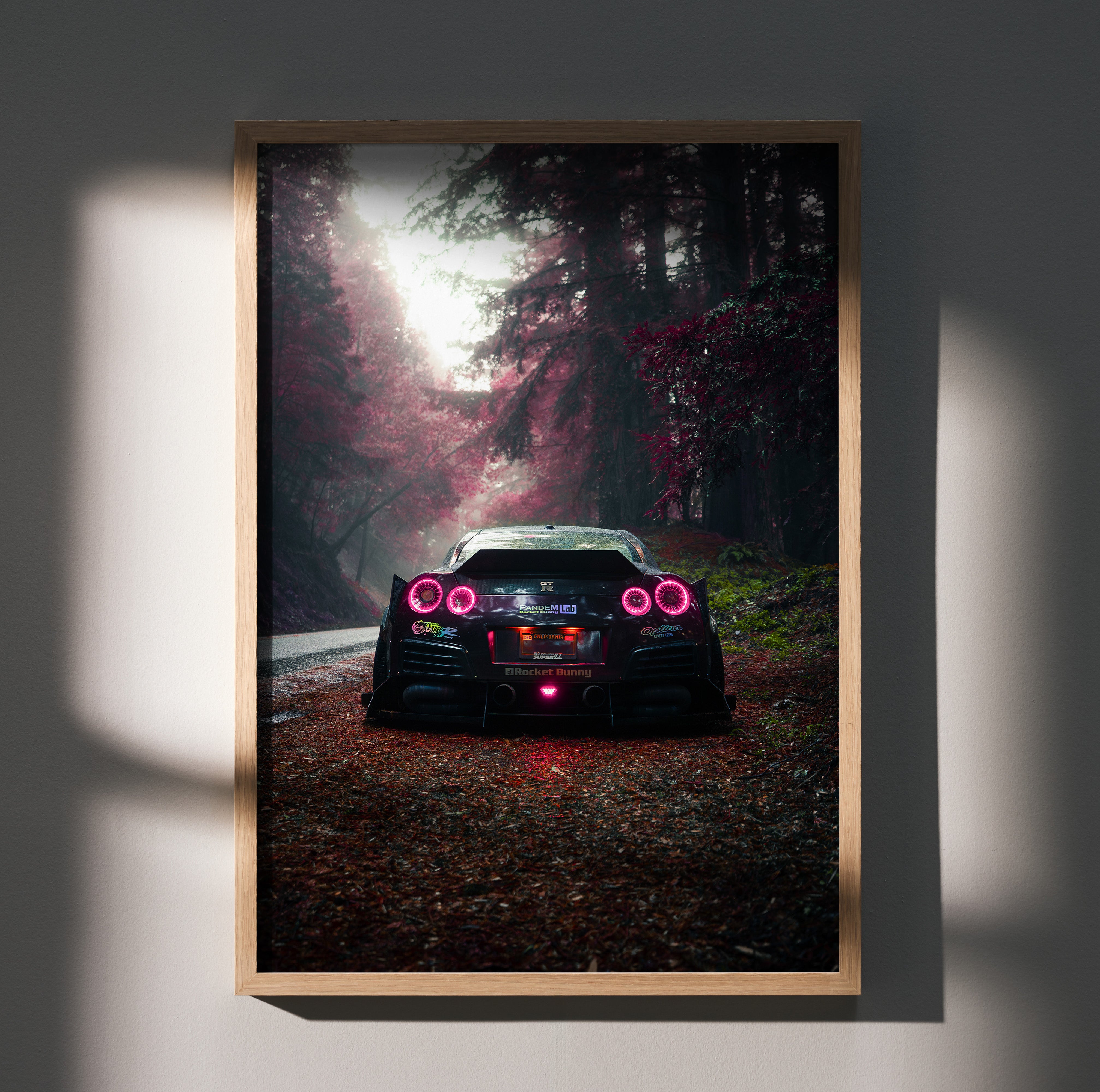 Nissan GTR R35 widebody rear view on forest road poster wall art with moody lighting.