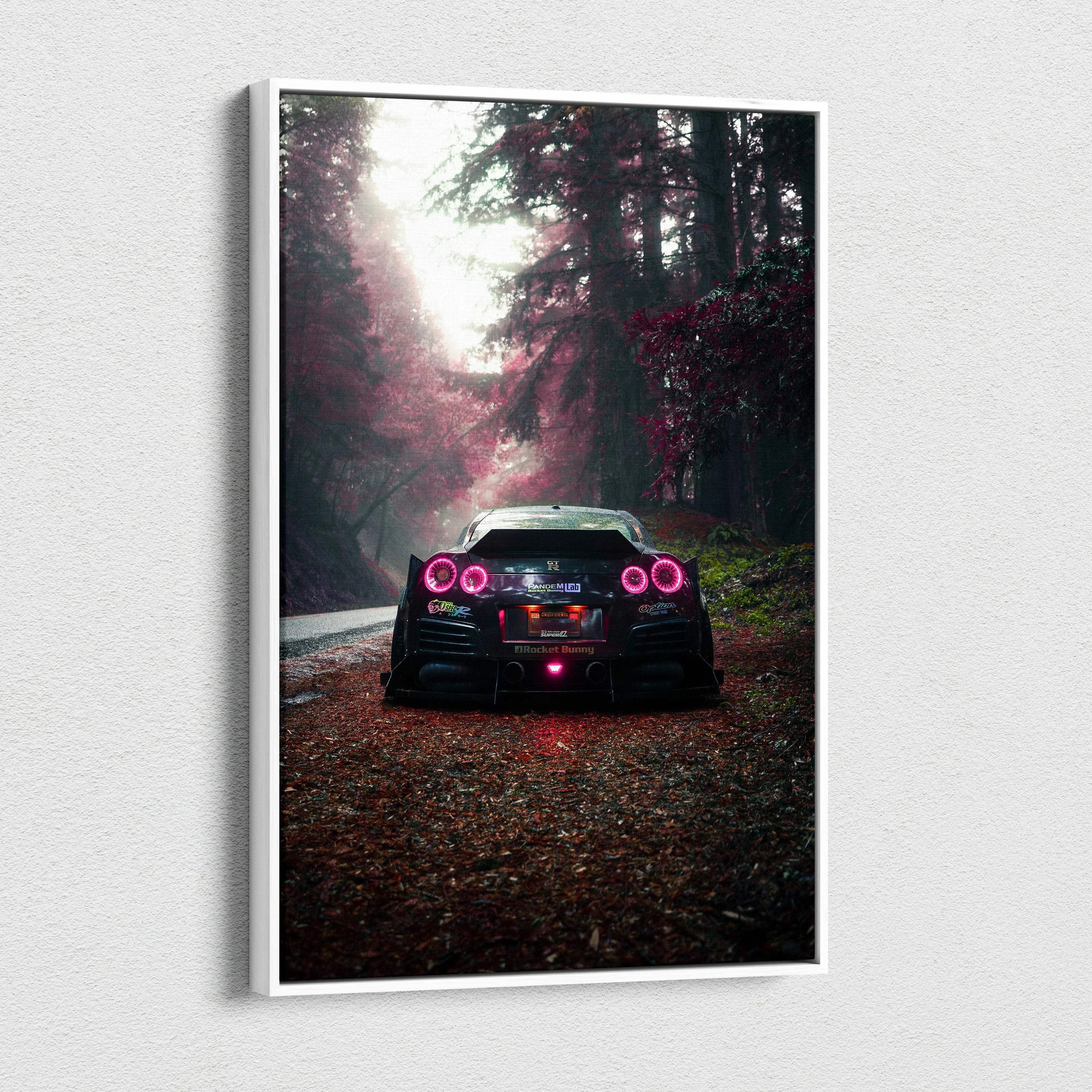 Vertical canvas art of a black Nissan R35 GTR with red tail lights on a forest road, wall art print.