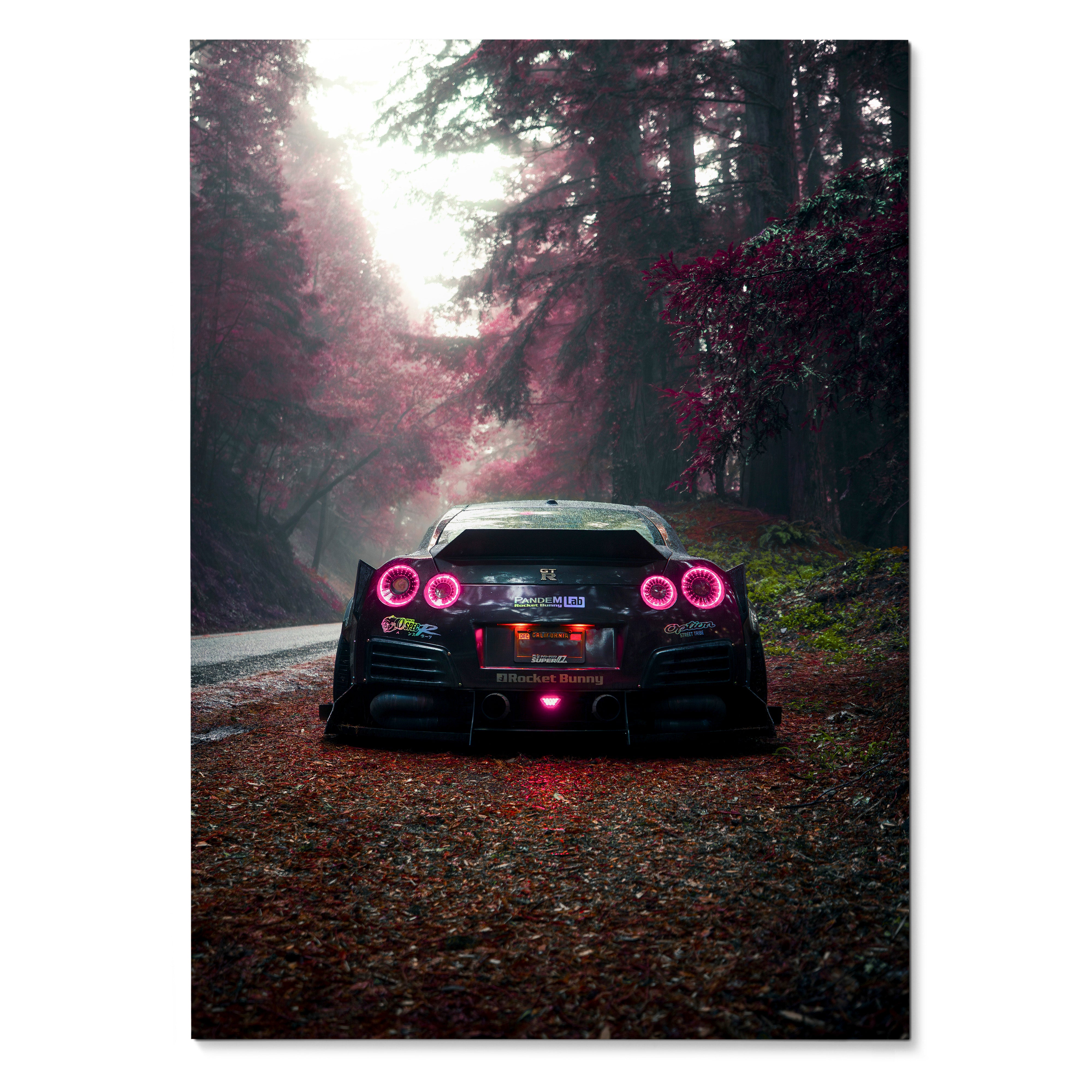 Nissan GTR R35 Widebody rear view on forest road poster wall art with glowing taillights.