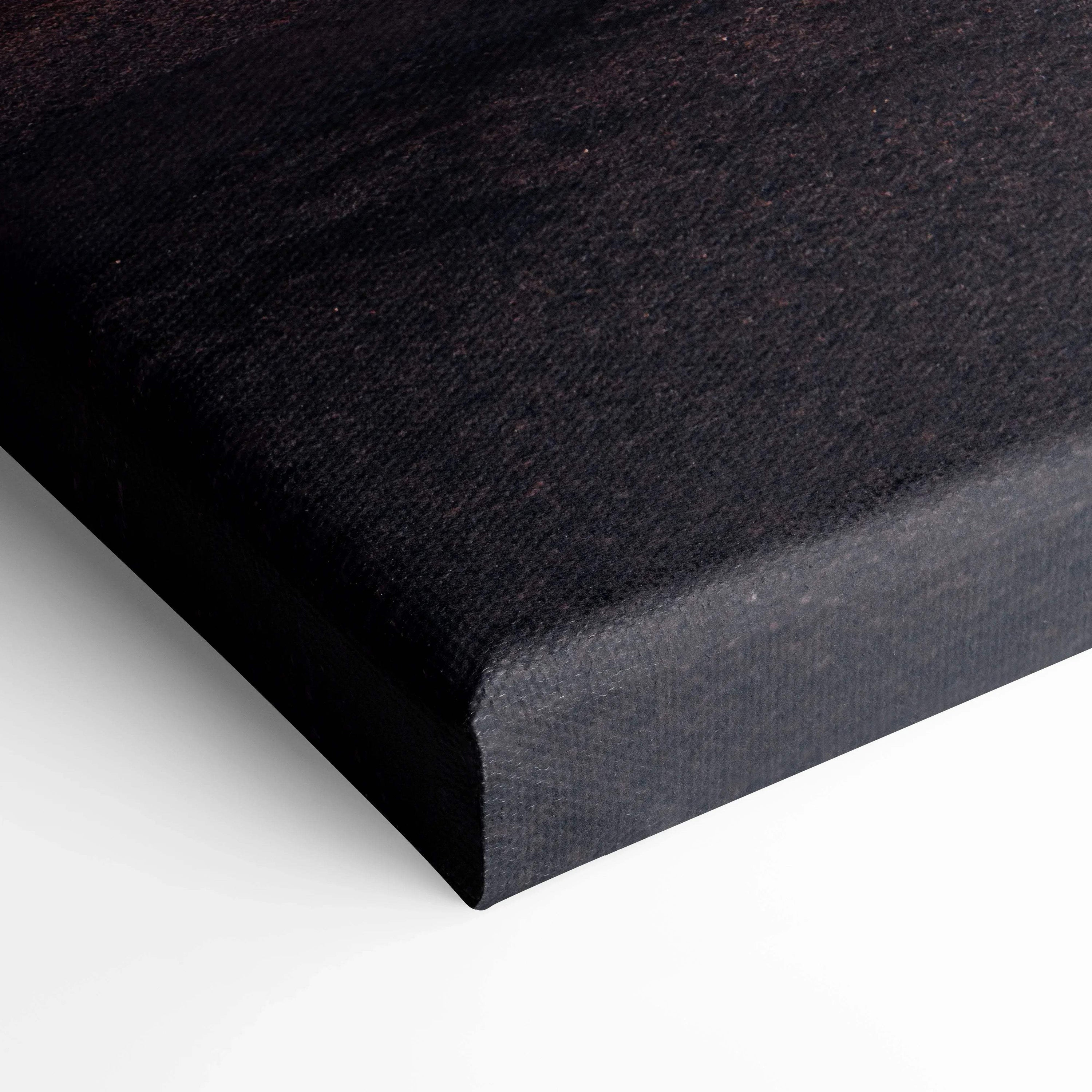 Close-up of dark textured canvas corner for wall art print with precise gallery wrap edges.