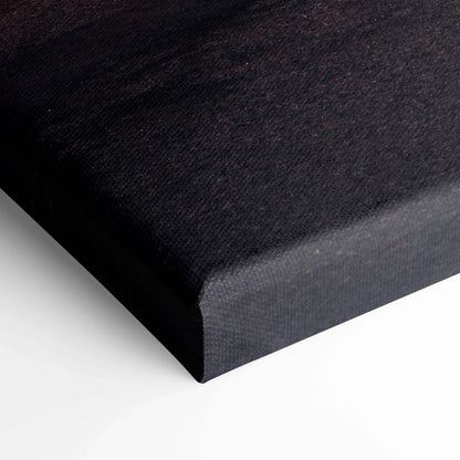 Close-up of dark textured canvas corner for wall art print with precise gallery wrap edges.