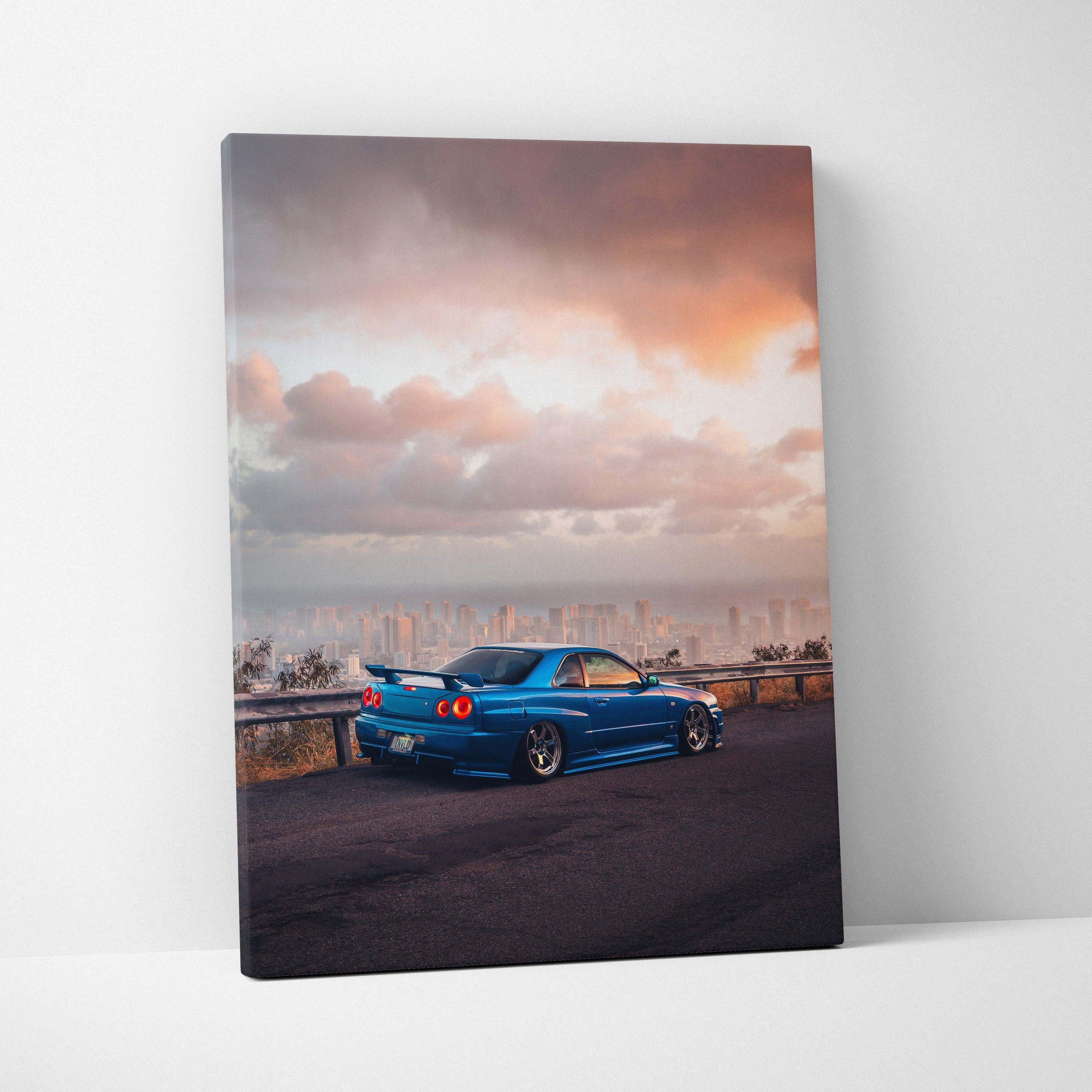 Nissan R34 GTR Skyline in blue parked by railing at sunset canvas wall art print.