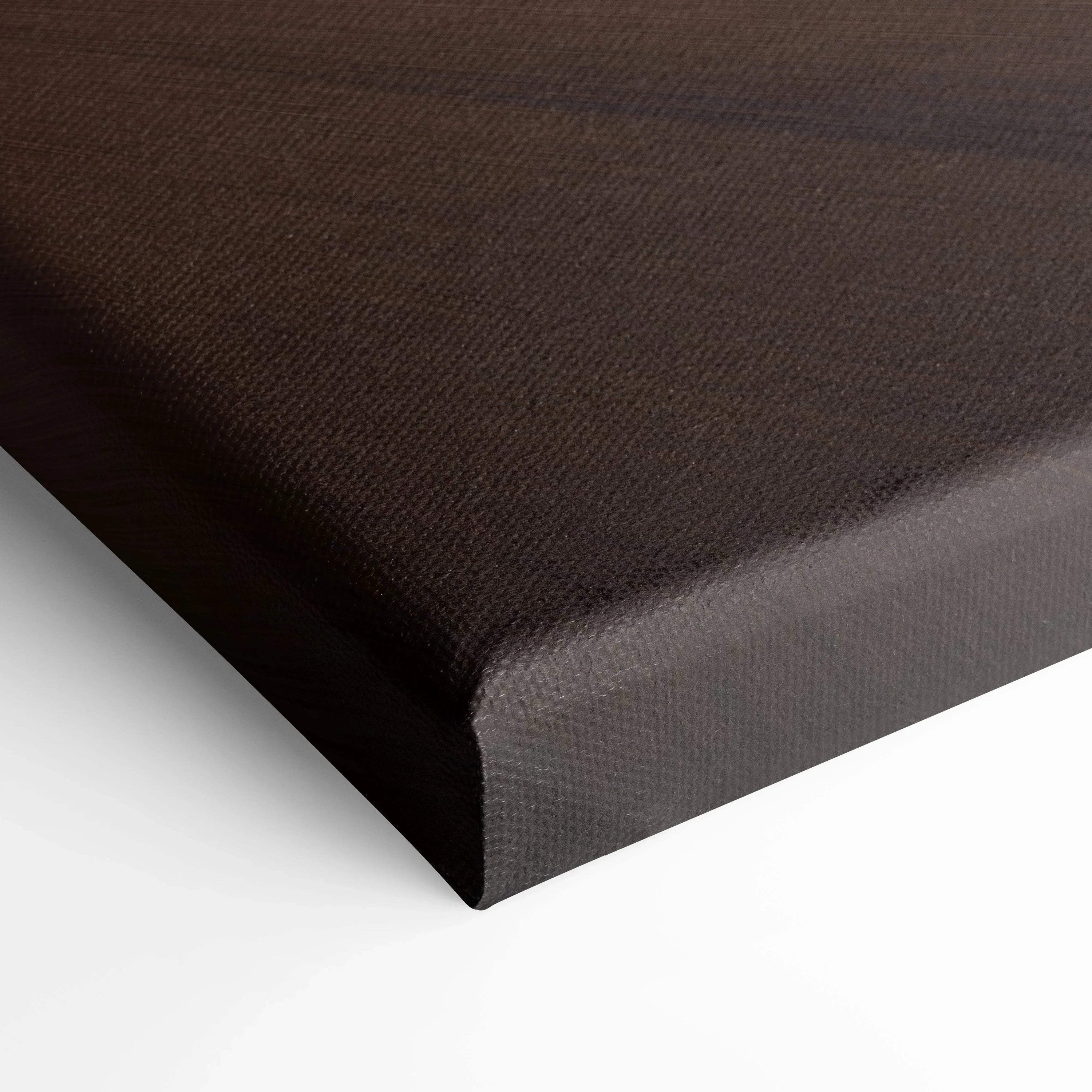 Close-up of dark brown textured canvas wall art with gallery-wrapped edges.