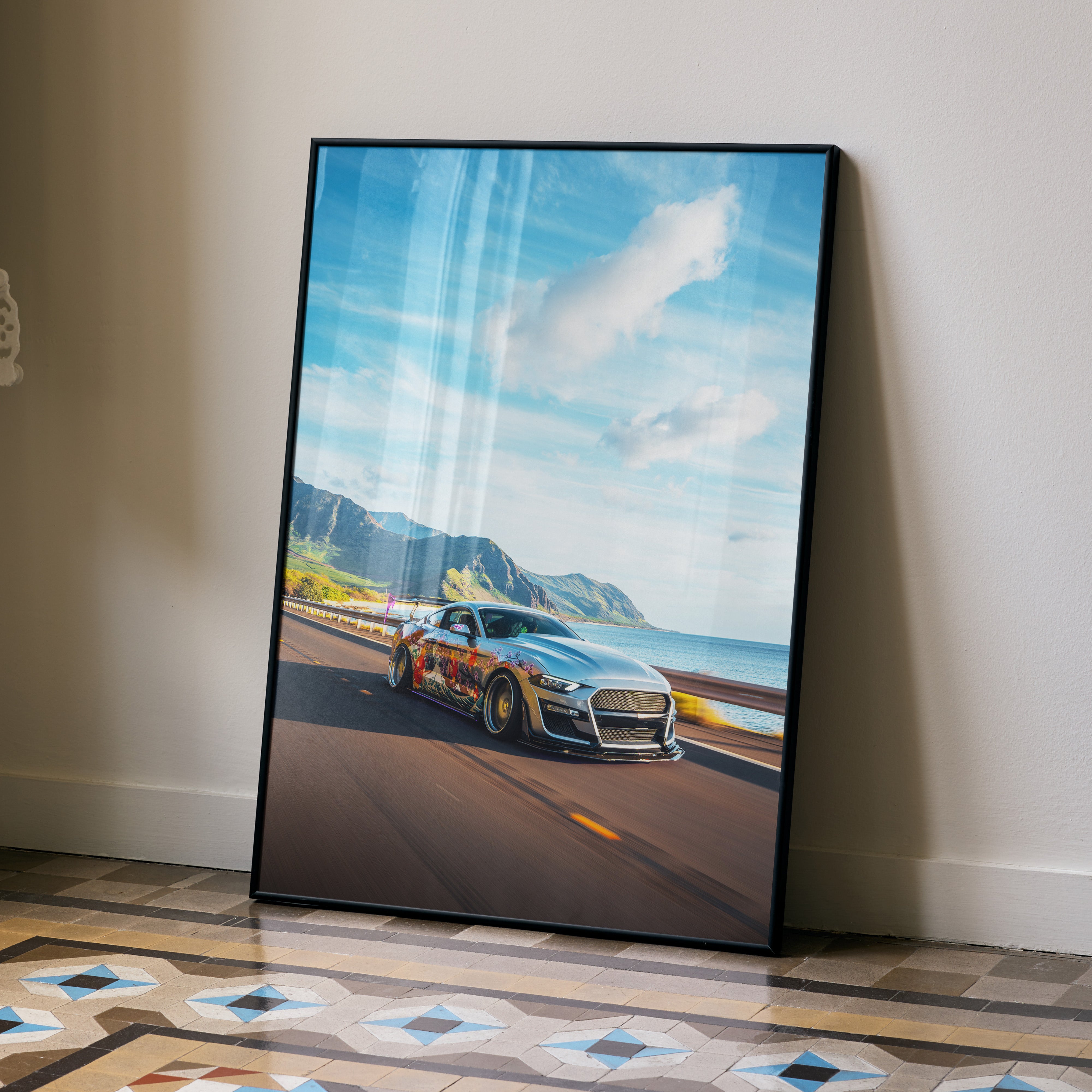 Ford Mustang S550 poster showing black sports car on coastal road under blue sky, framed wall art.