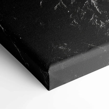 Black canvas wall art corner showing textured fabric with white snowy tree branches print.