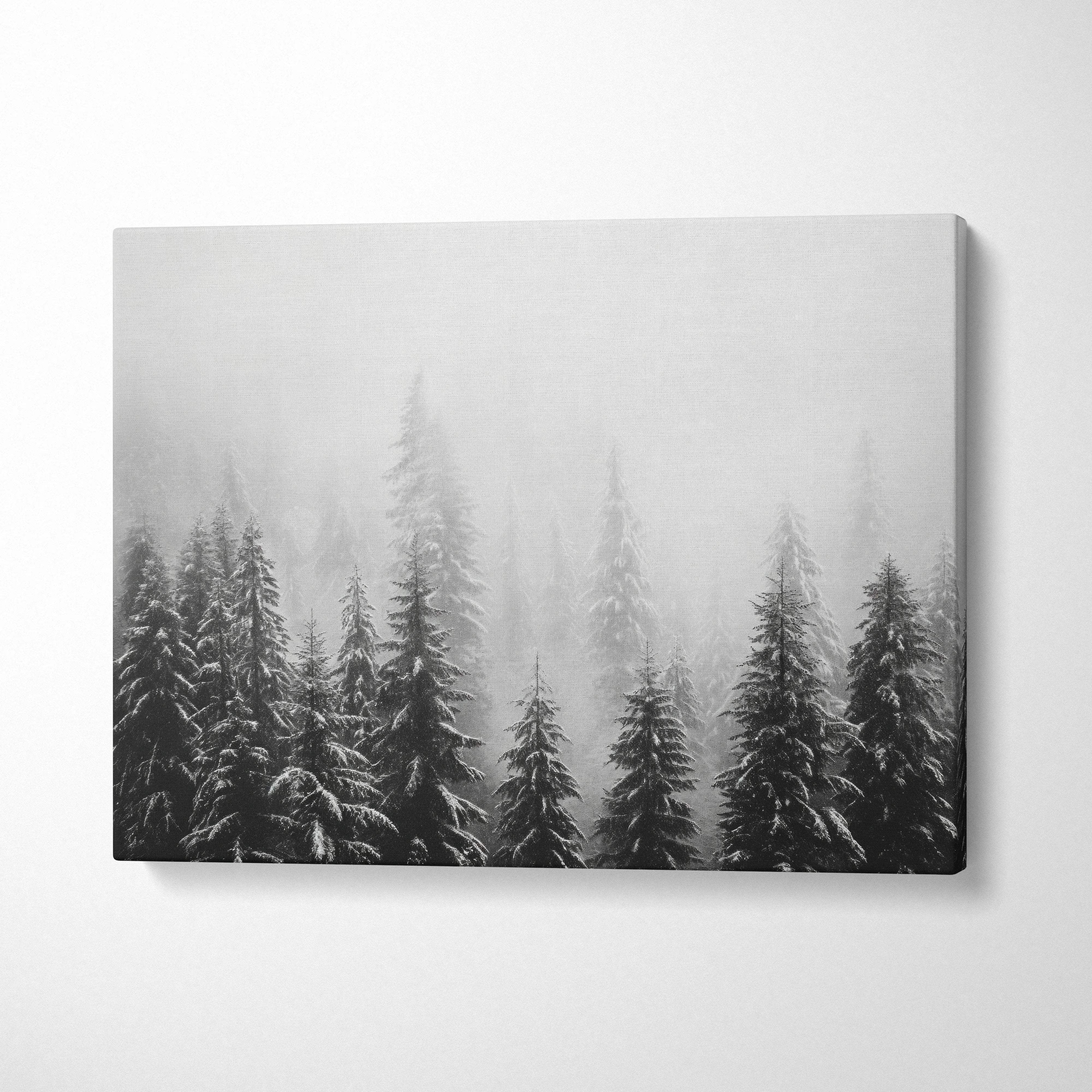 Winter forest scene with snow-covered pine tree tops on gray canvas wall art decor.
