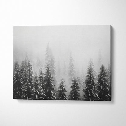 Winter forest scene with snow-covered pine tree tops on gray canvas wall art decor.