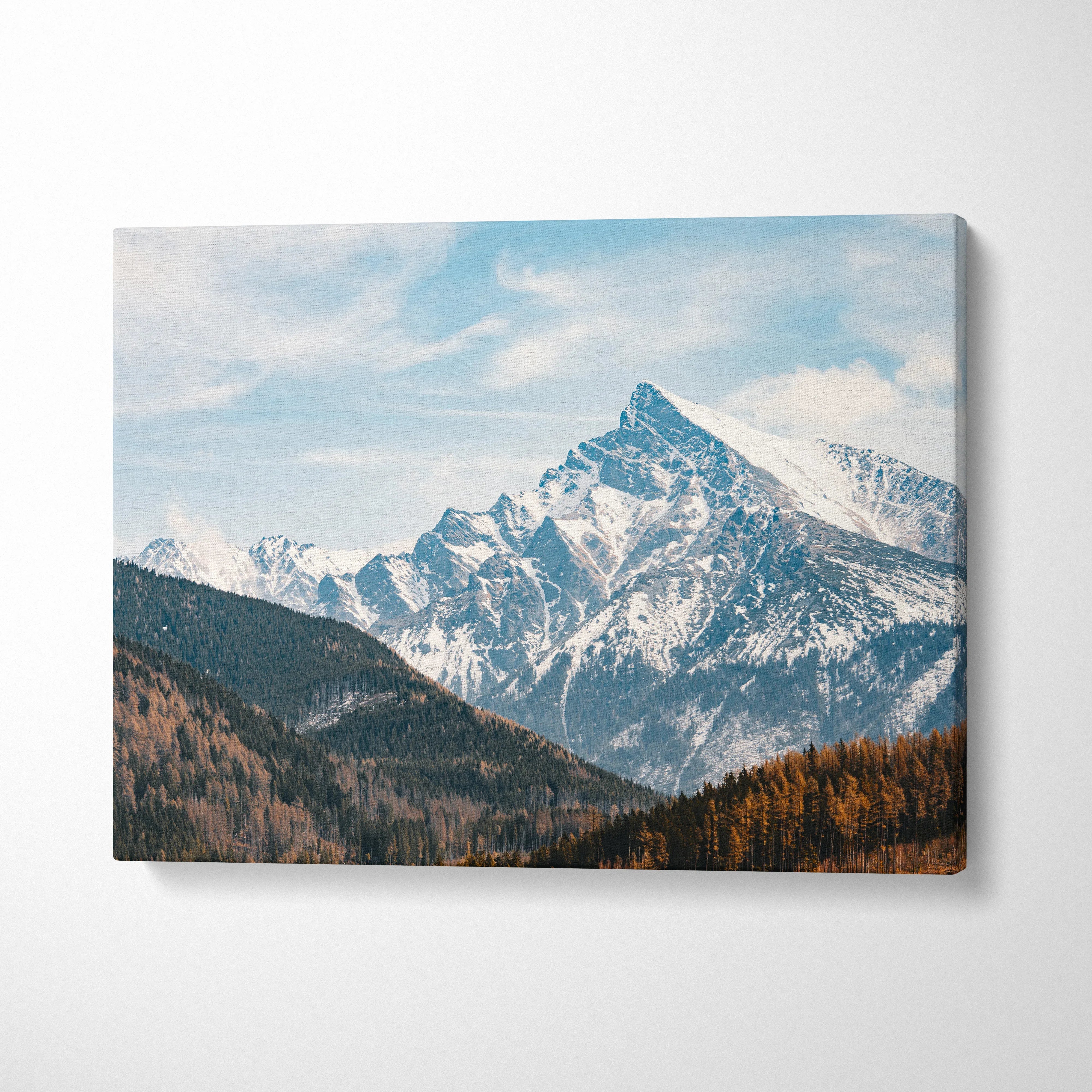 Canvas wall art with snowy mountain peak and blue sky, winter landscape decor.