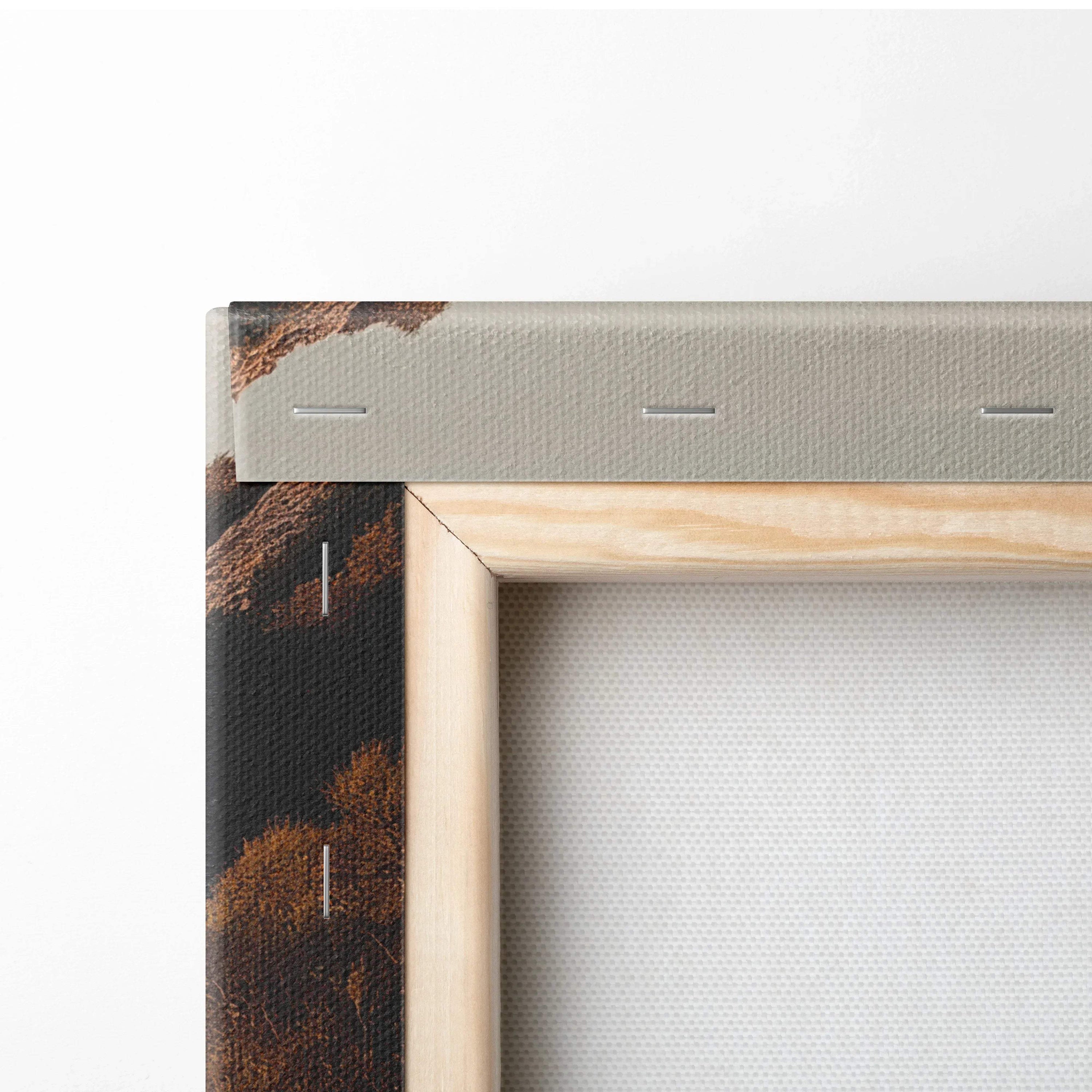 Close-up of canvas edge and wooden stretcher bar on textured wall art print.