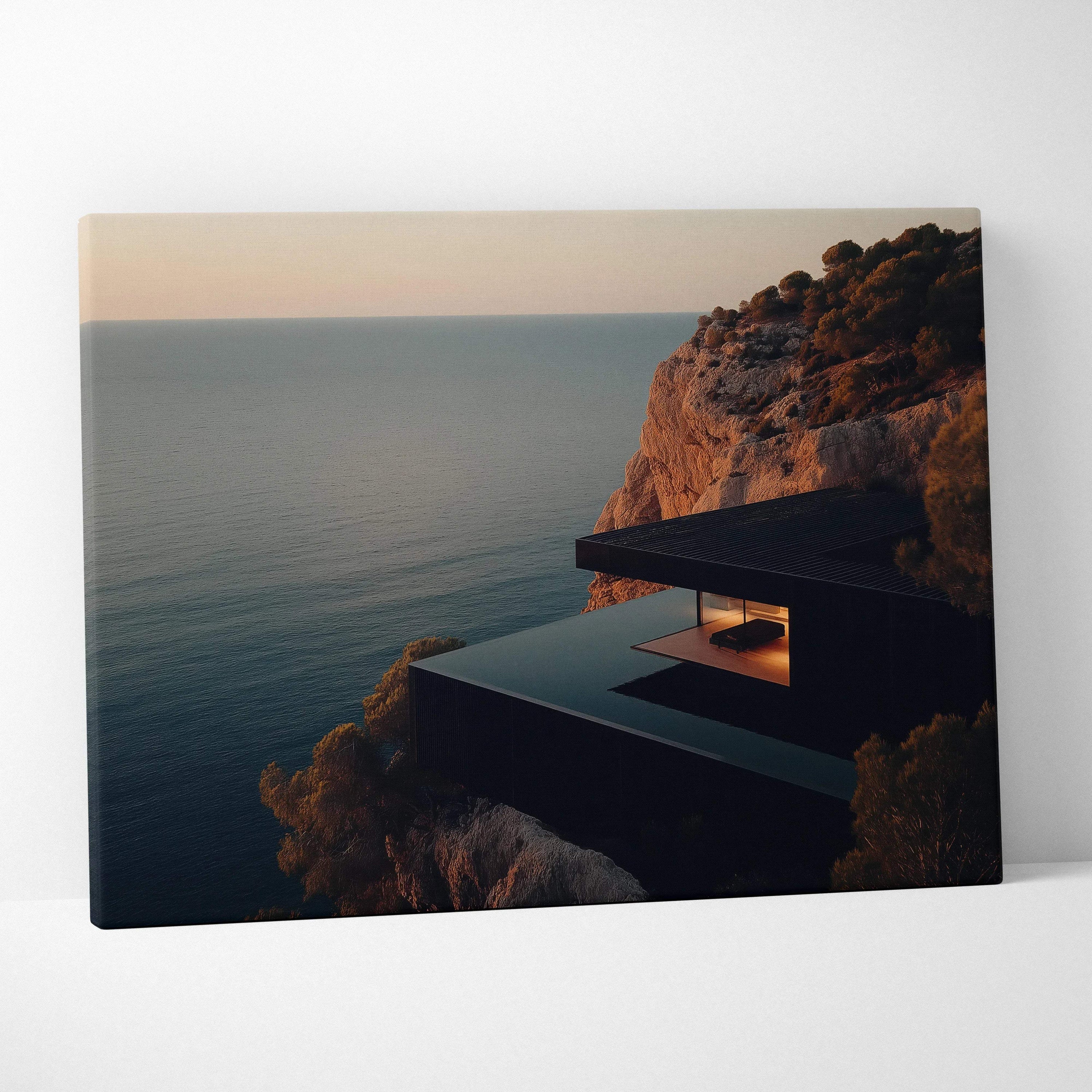 Canvas wall art featuring modern architectural structure on cliffside overlooking calm ocean at sunset.