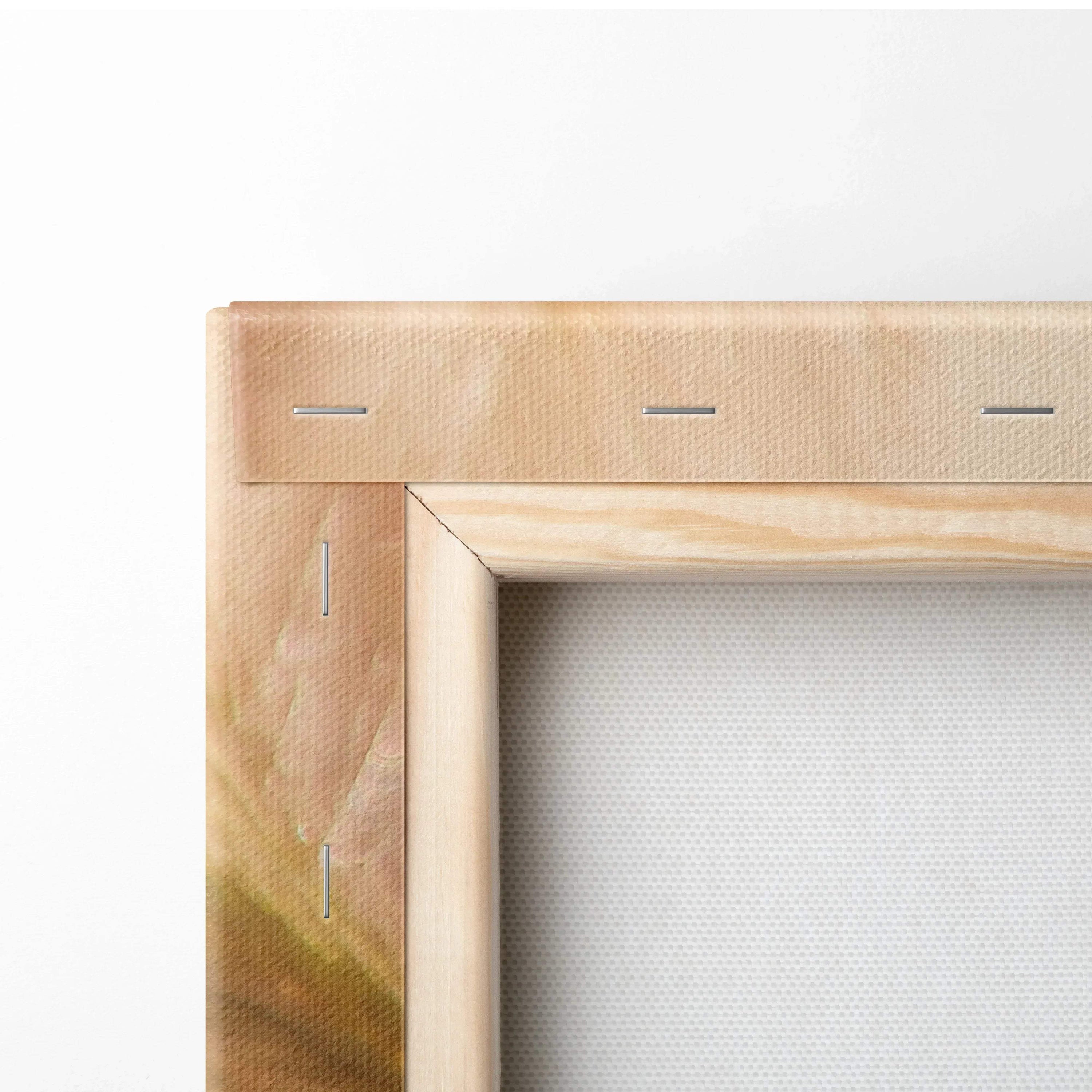 Close-up of wooden stretcher frame with white canvas stretched for wall art decor.