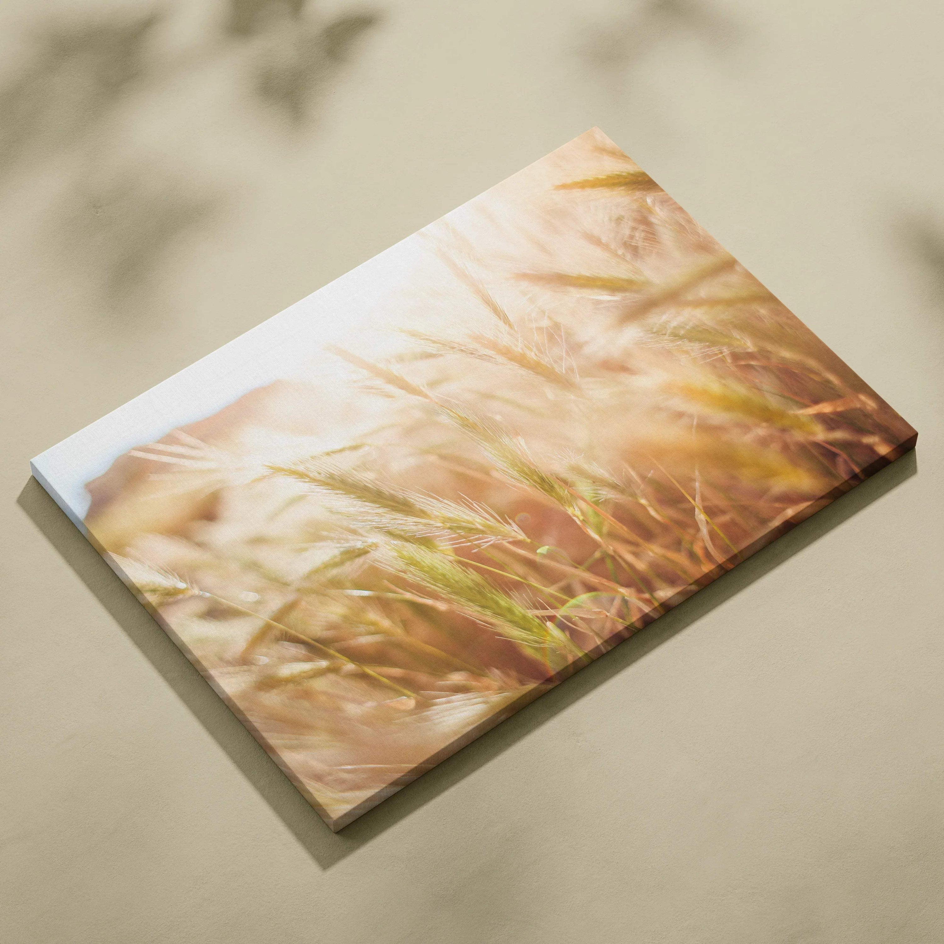 Canvas wall art featuring golden summer wheat field with soft floral highlights in warm sunlight tones.