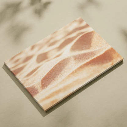 Minimalist canvas wall art depicting serene sand dunes in soft beige and warm tones, perfect decor piece.