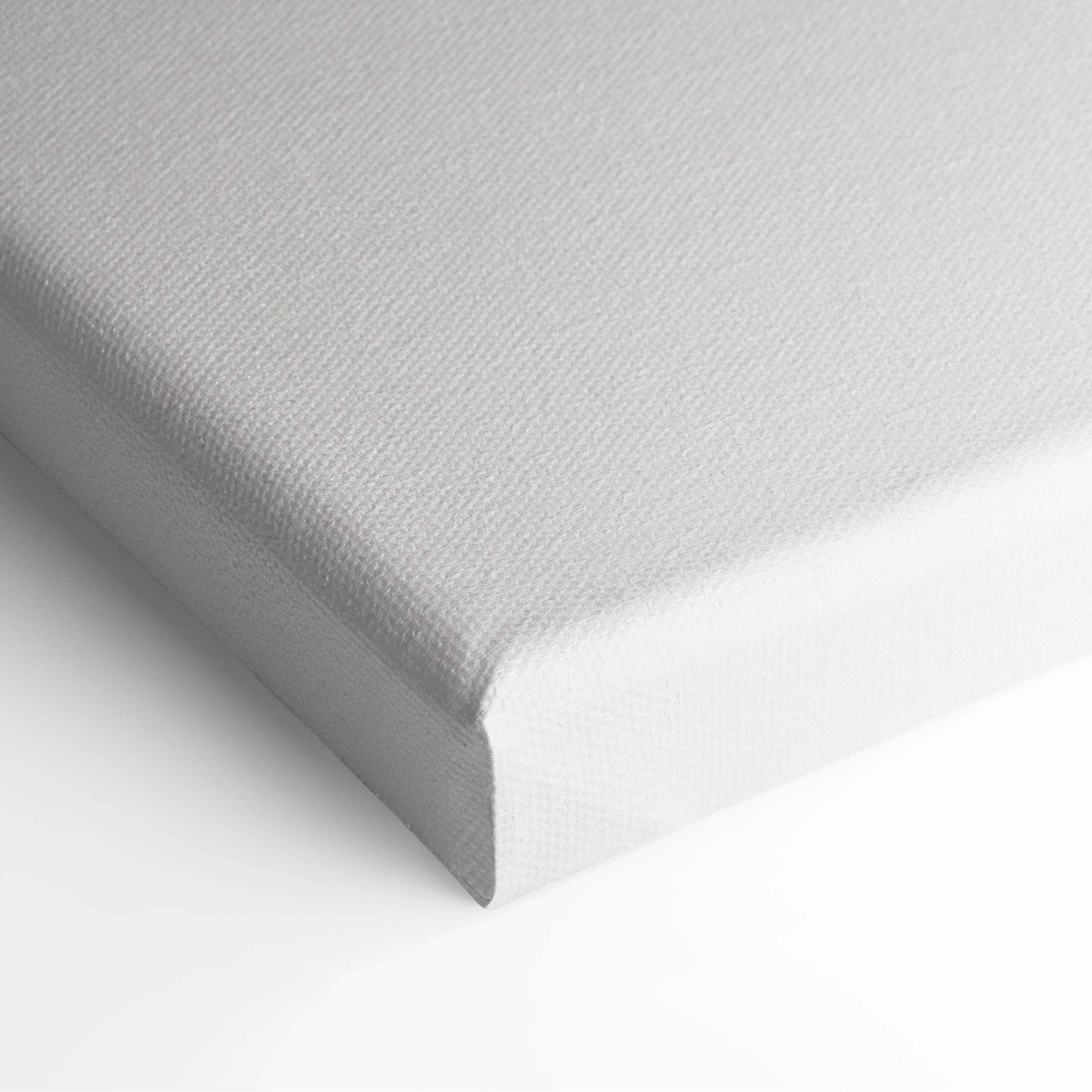 Close-up of white canvas wall art corner with textured fabric and clean edges.