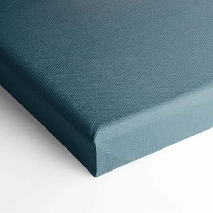 Blue textured canvas wrapped around a thick wooden frame for wall art decor.