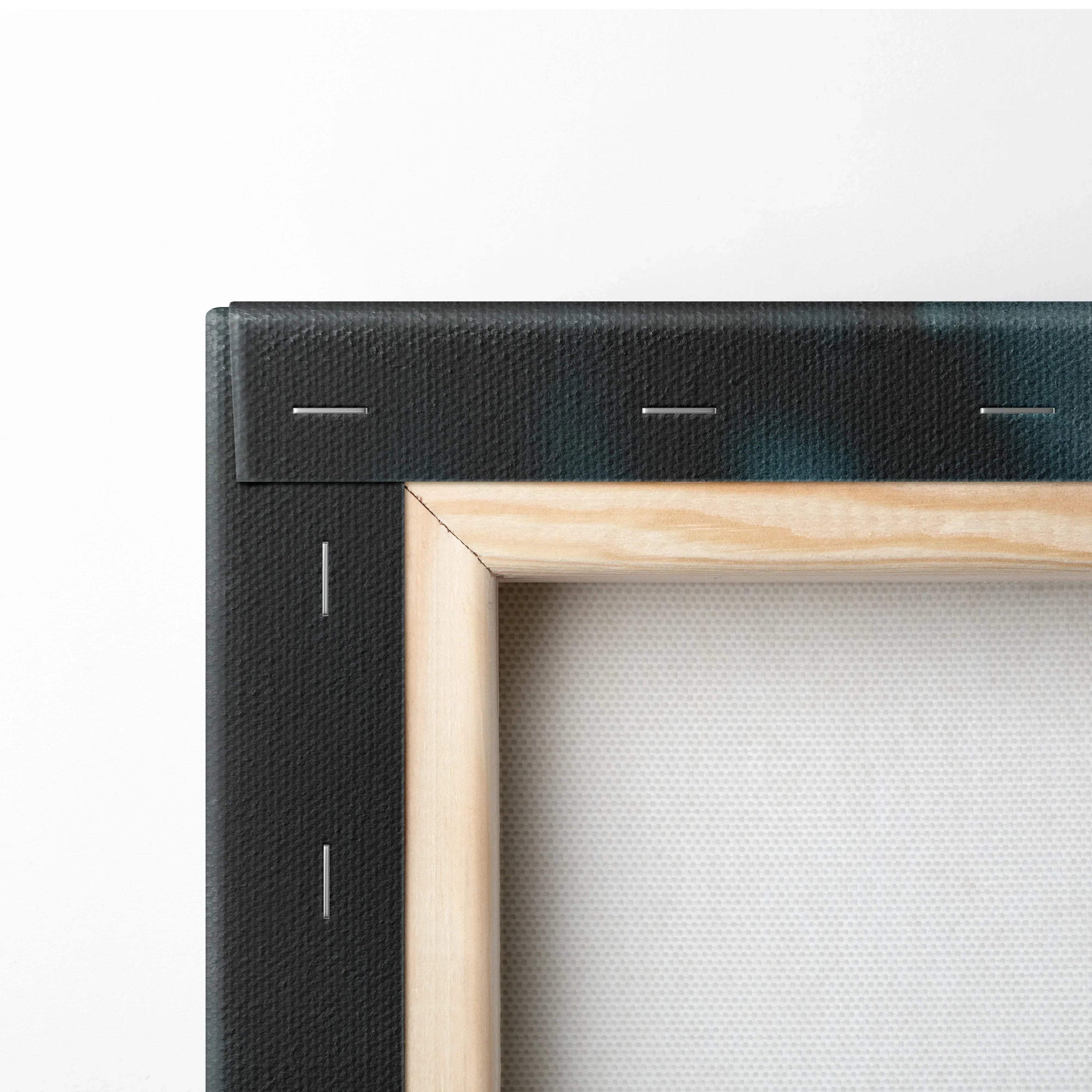 Close-up of wooden frame and black canvas edge with visible texture and metal staples for wall art decor.