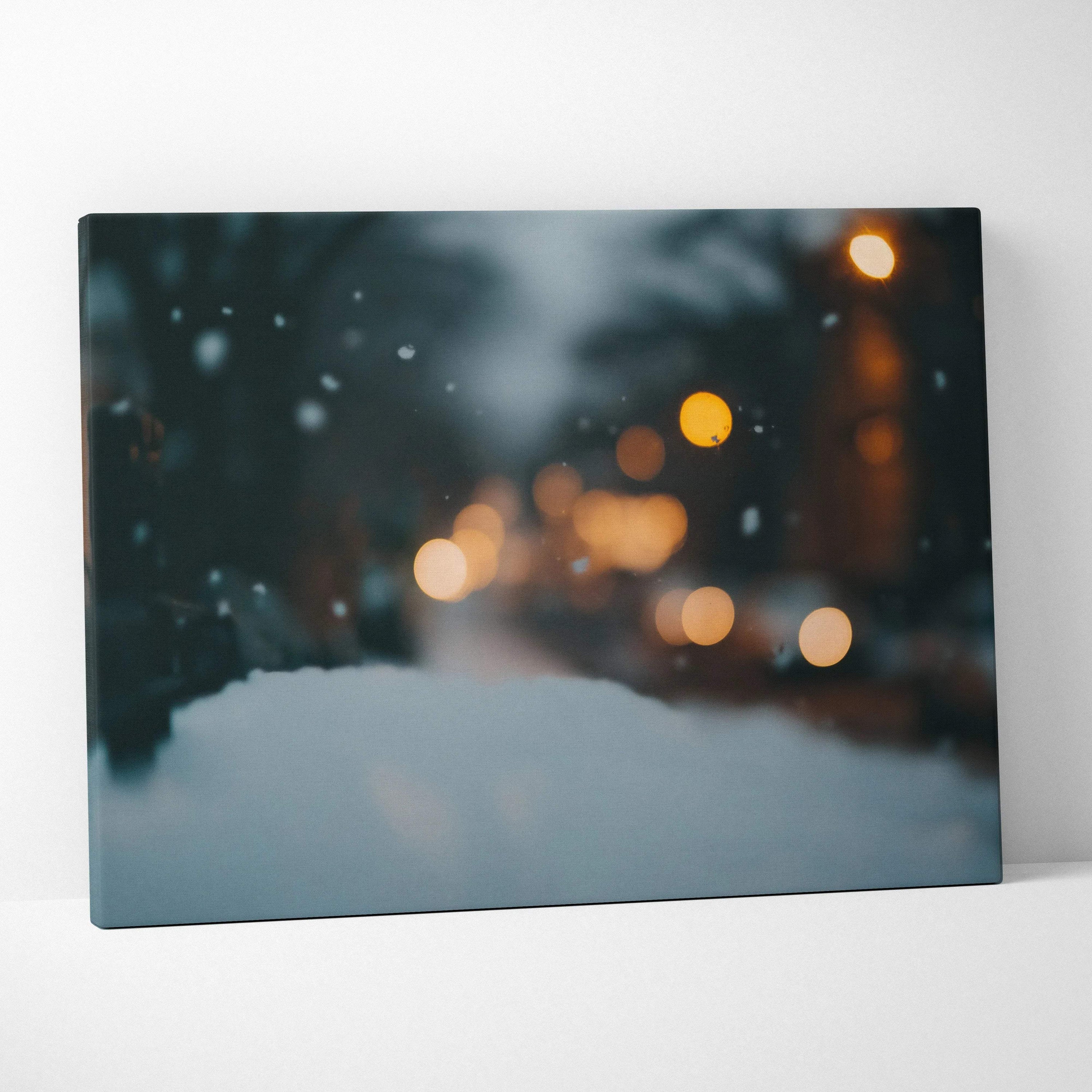 Winter-themed canvas wall art featuring soft bokeh lights in cool blue and warm amber tones, creating a serene snowy night.