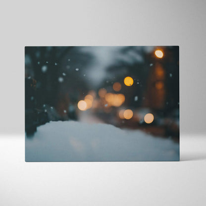 Winter bokeh canvas wall art with blurred snow and warm glowing lights for home decor.