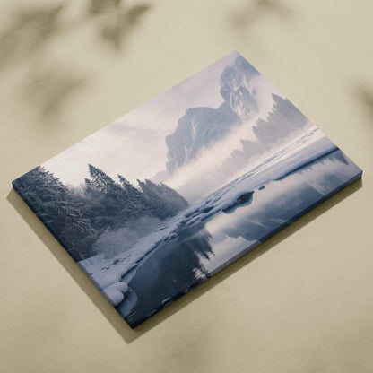 Canvas wall art featuring a frozen winter mountain landscape with snow-covered trees and a winding icy river.