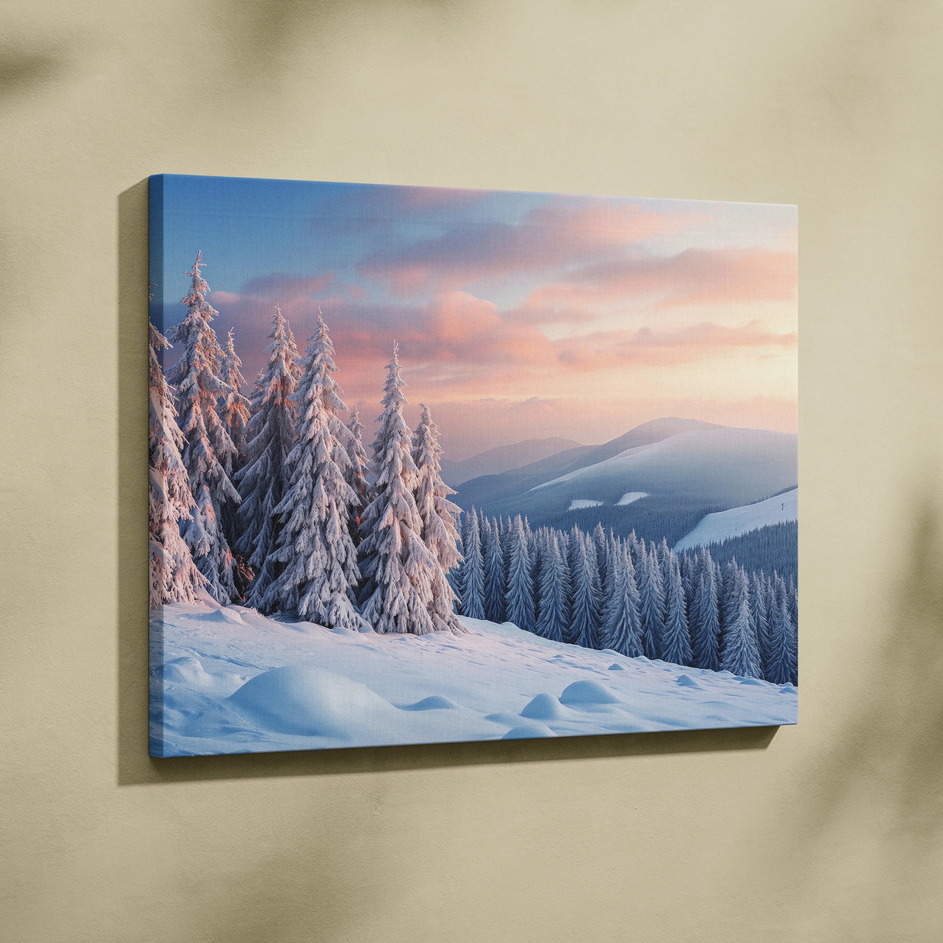 Canvas wall art featuring a snowy mountain peak at sunset with pink and orange sky and snow-covered pine trees.